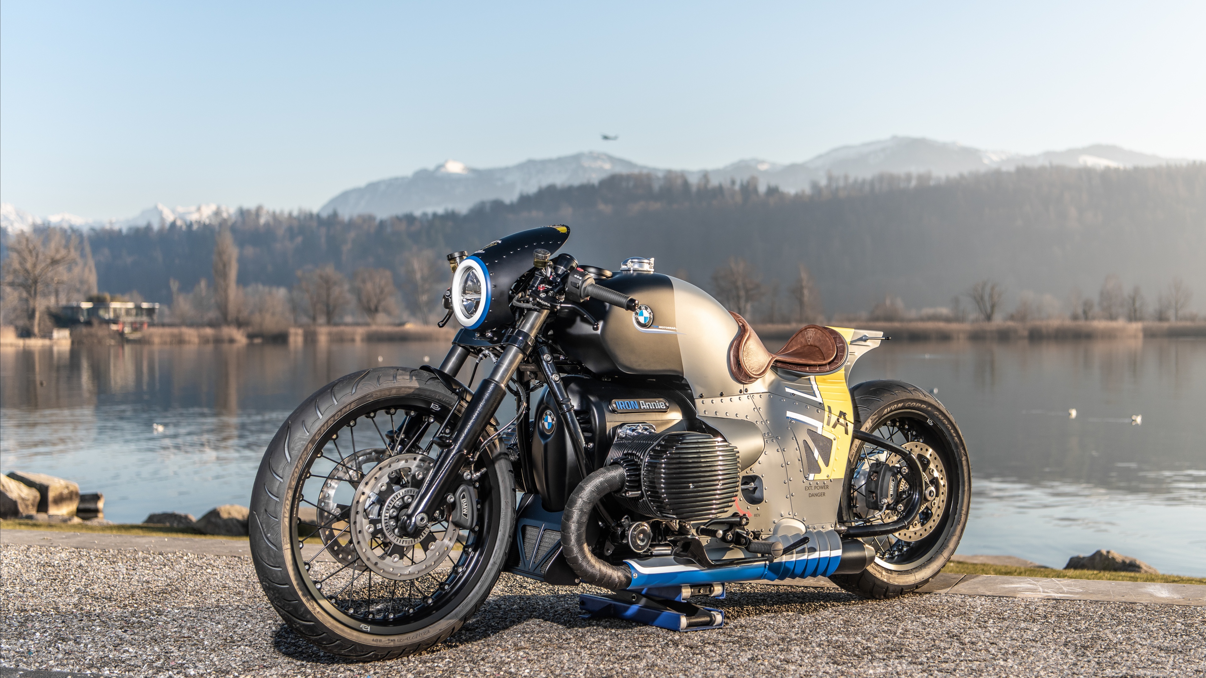 Detailed view of a 2023 BMW R 18 custom motorcycle with the Iron Annie design, featuring a heavy boxer engine and metallic finishes.