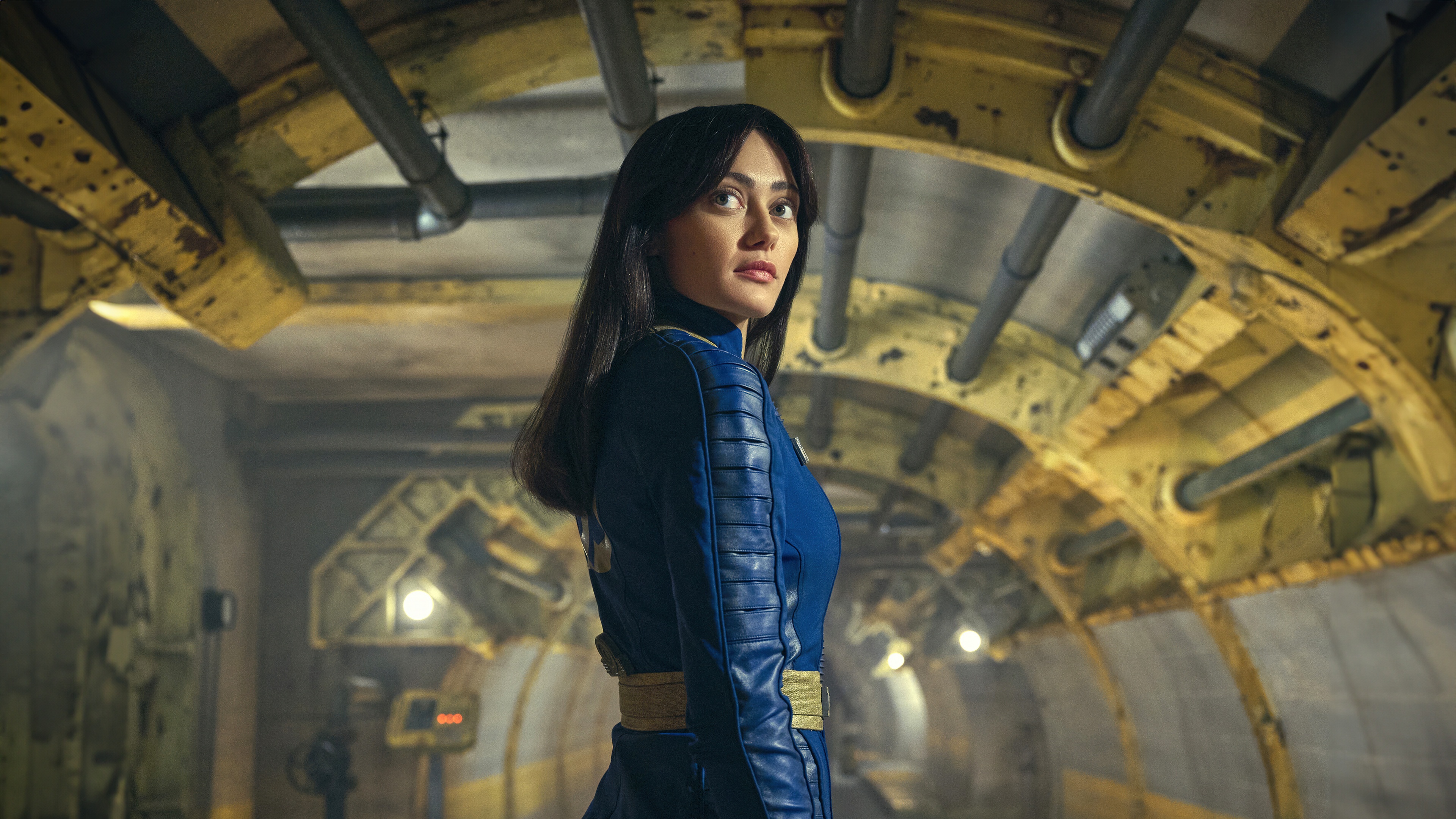 Cinematic close-up portrait of Lucy MacLean, played by Ella Purnell, from the Fallout television series on Amazon Prime Video.