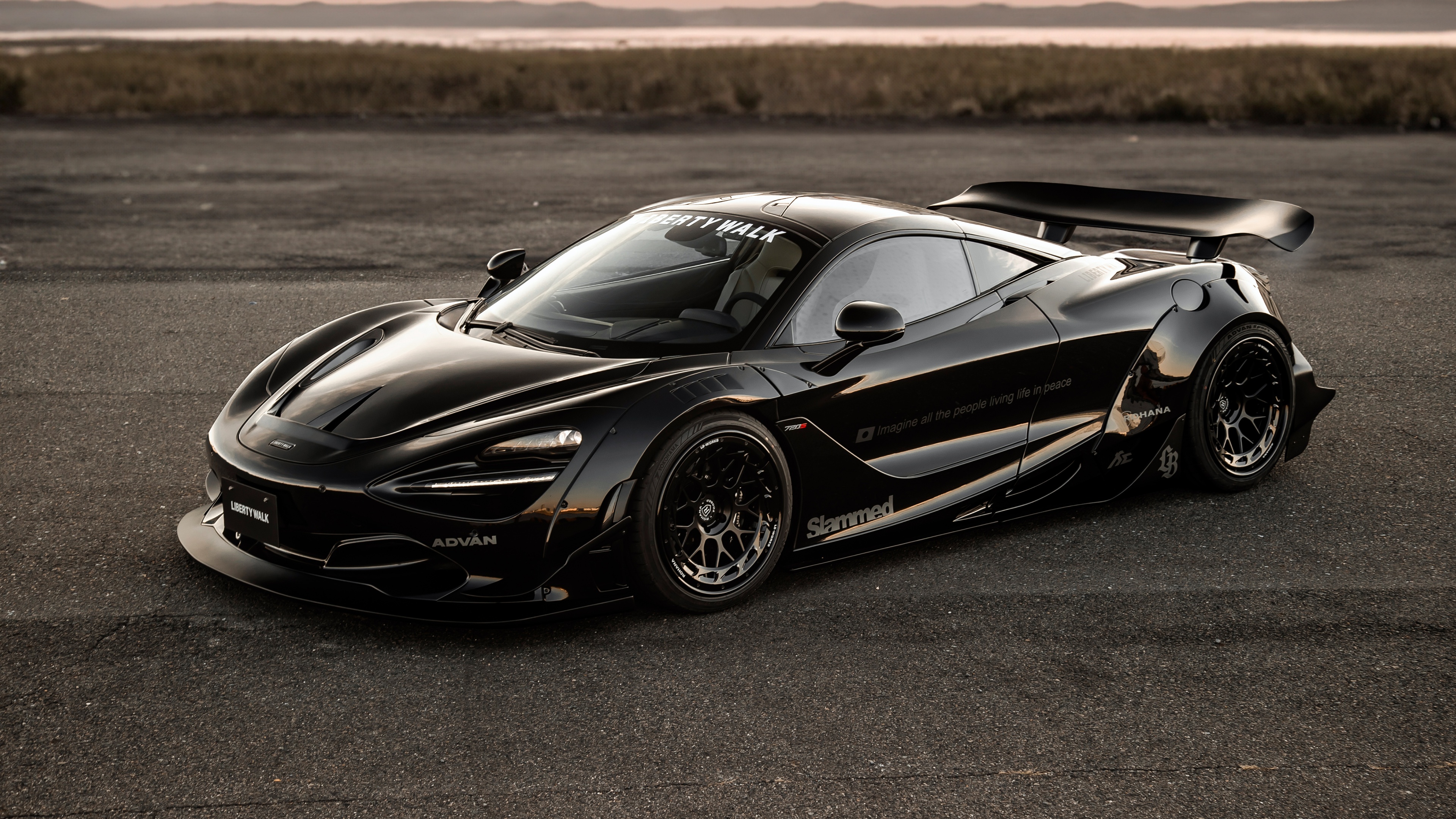 A high-detail 5K shot of a sleek, glossy black McLaren 720S supercar.