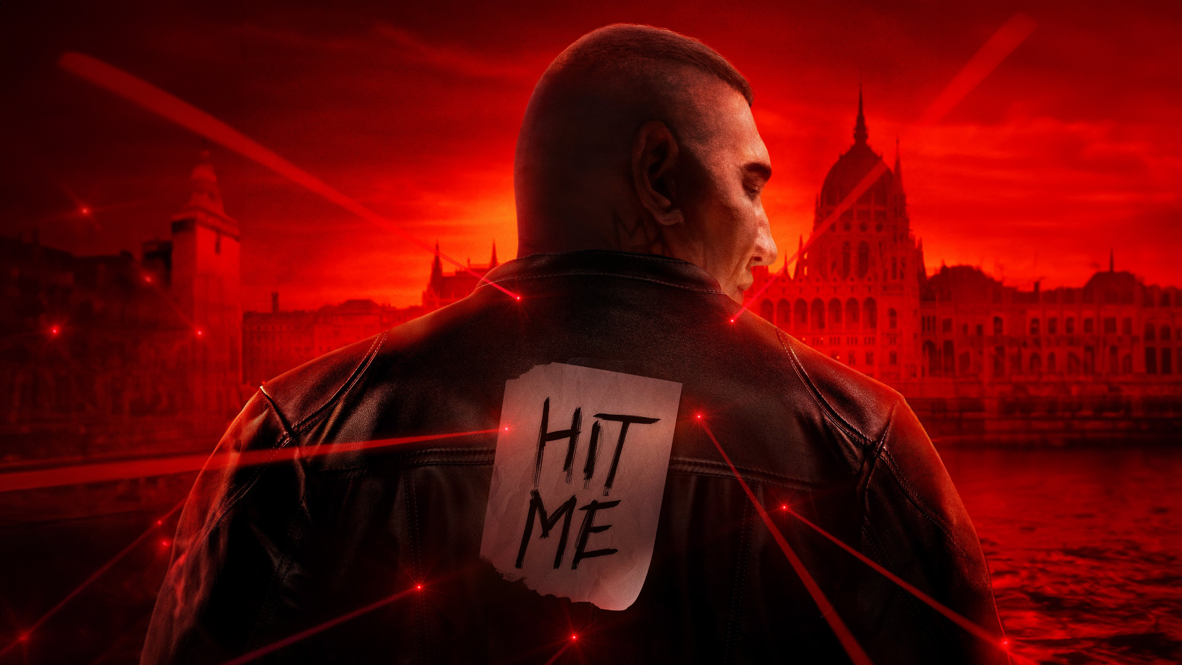 Dave Bautista as Miles Logan in a dramatic red-toned cinematic shot from the movie The Killer's Game.