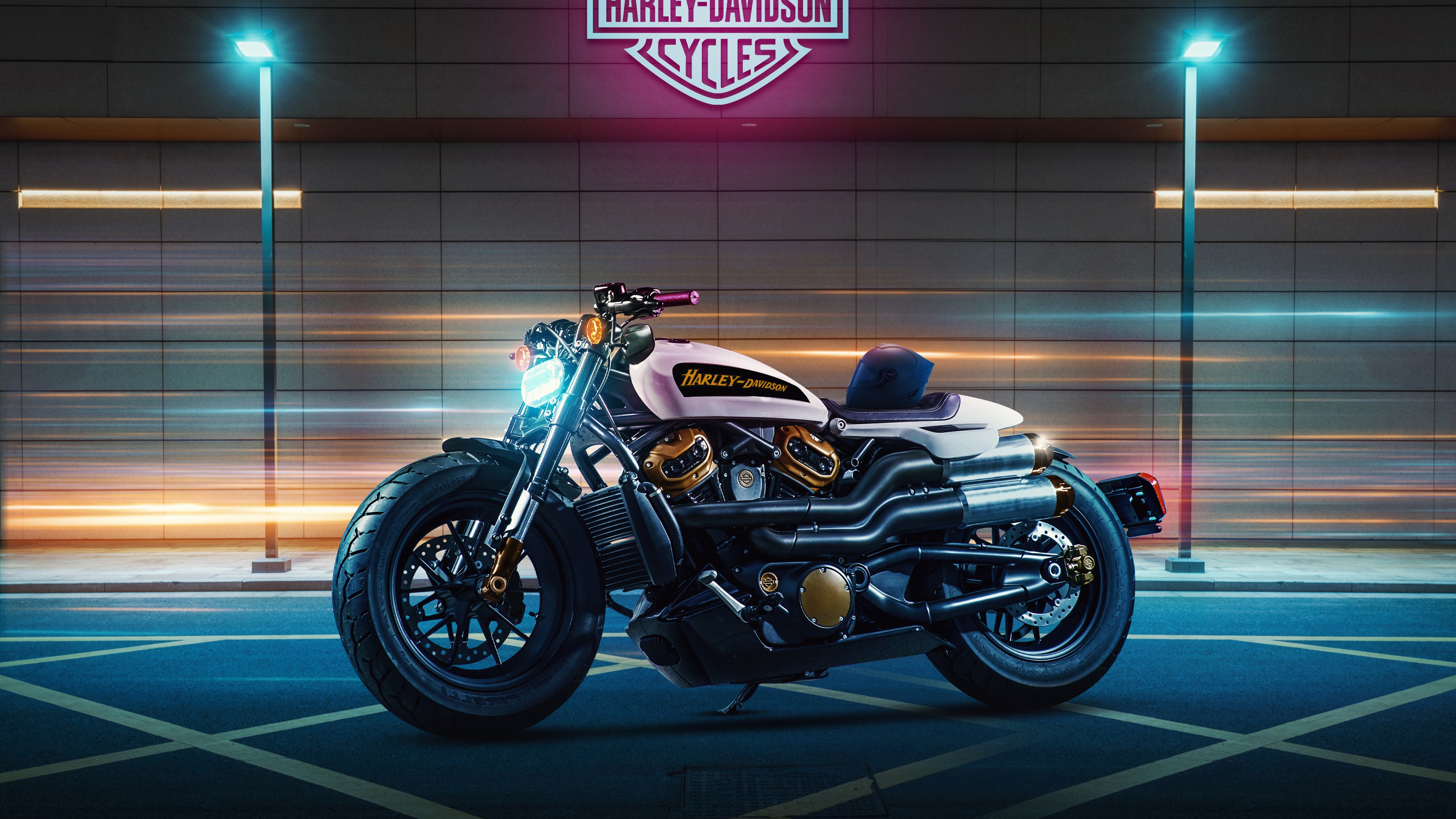 Harley-Davidson Sportster S motorcycle illuminated by vibrant neon lights in a dark night setting