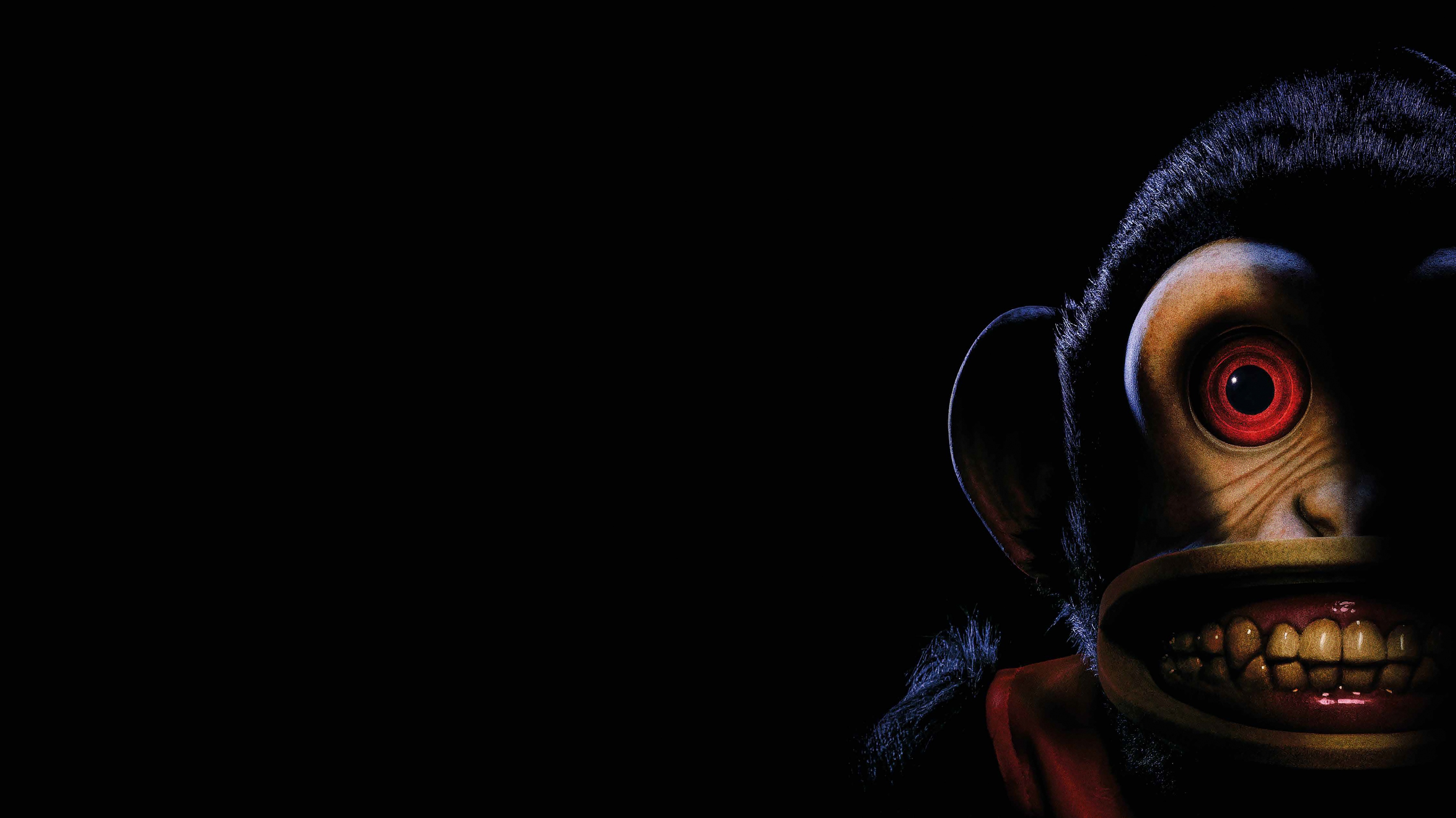 A cinematic horror-themed image featuring a mysterious, dark silhouette emerging from a pitch-black background, embodying the dread of upcoming 2025 horror films.