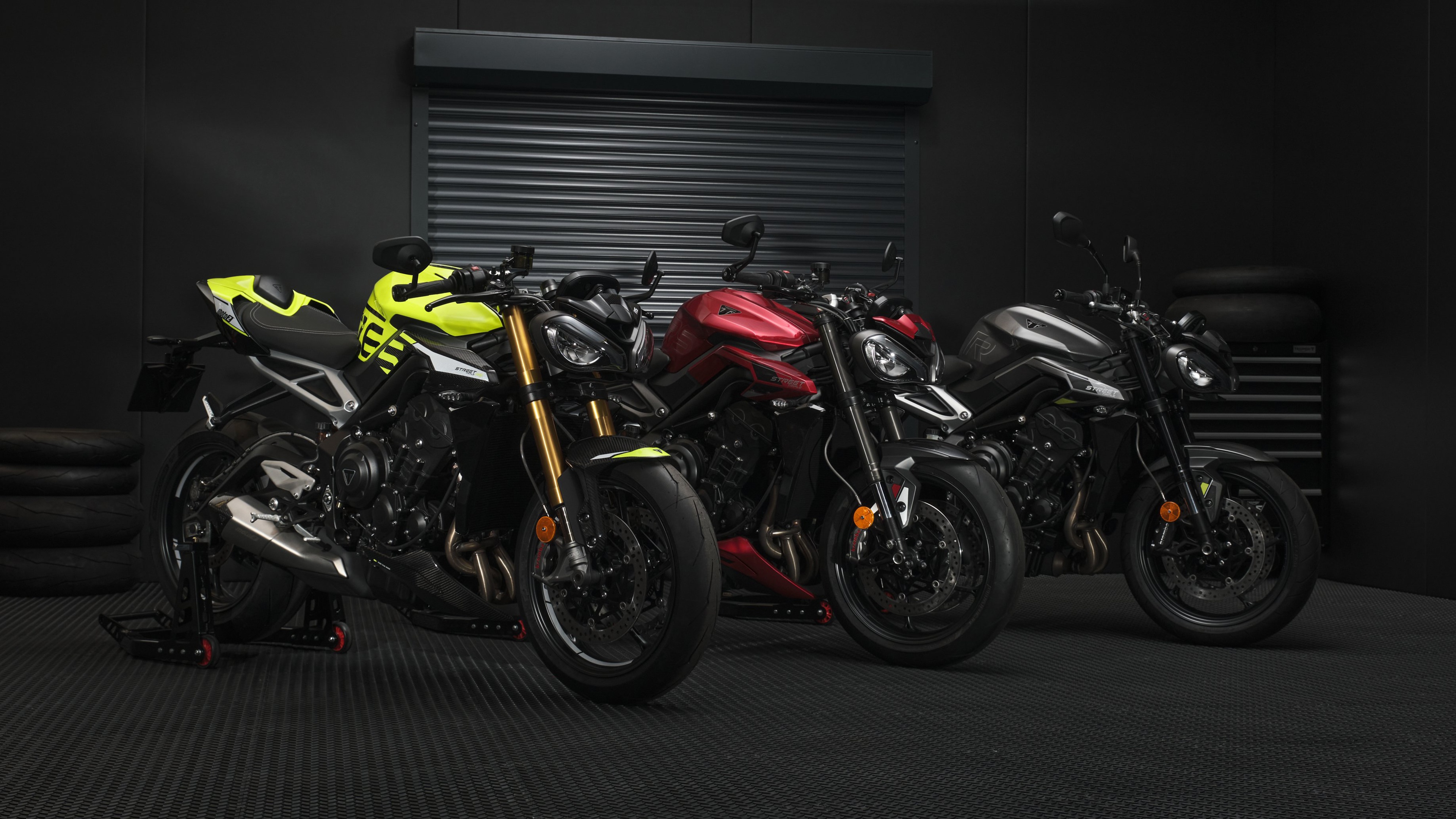 Close-up of a Triumph Street Triple 765 Moto2 Edition motorcycle with a dark, moody atmosphere.