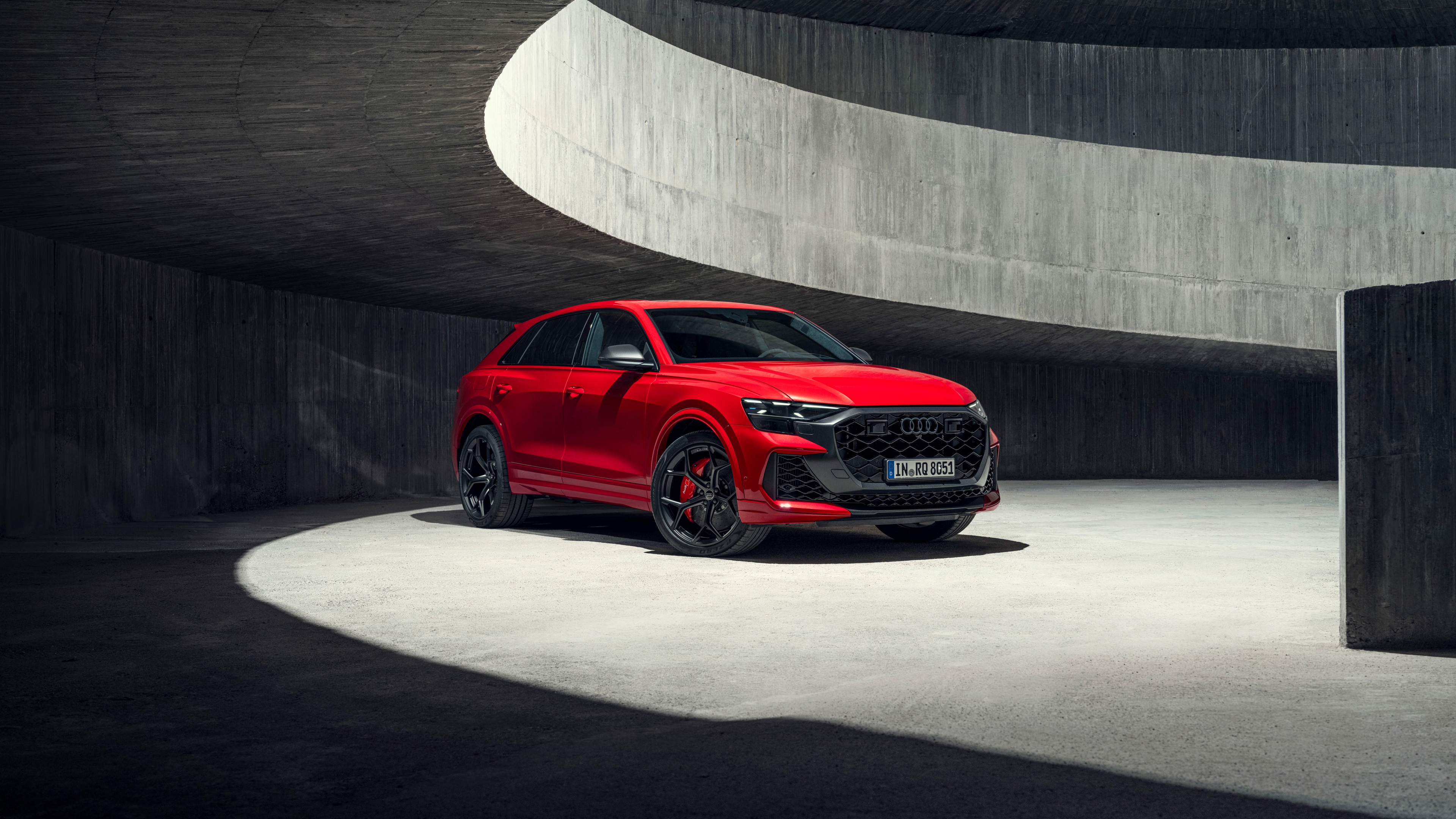 A high-resolution, detailed view of a red 2024 Audi RS Q8 performance SUV.