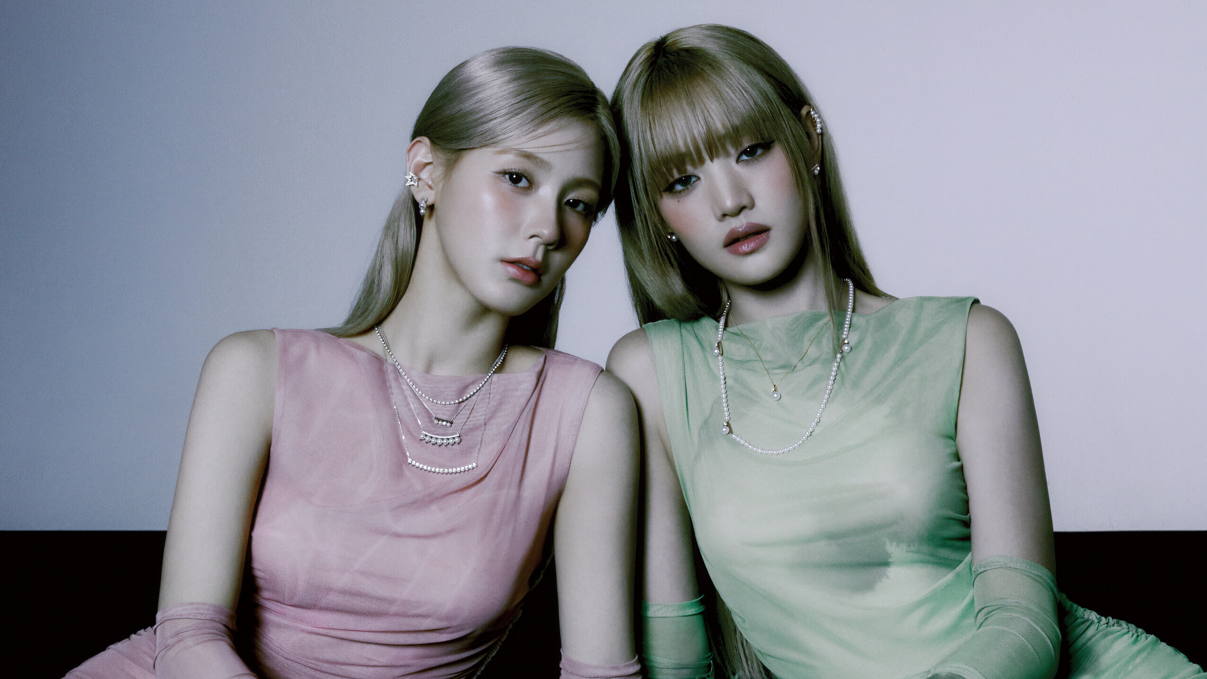 A high-quality close-up of K-pop singers Miyeon and Minnie from (G)I-DLE