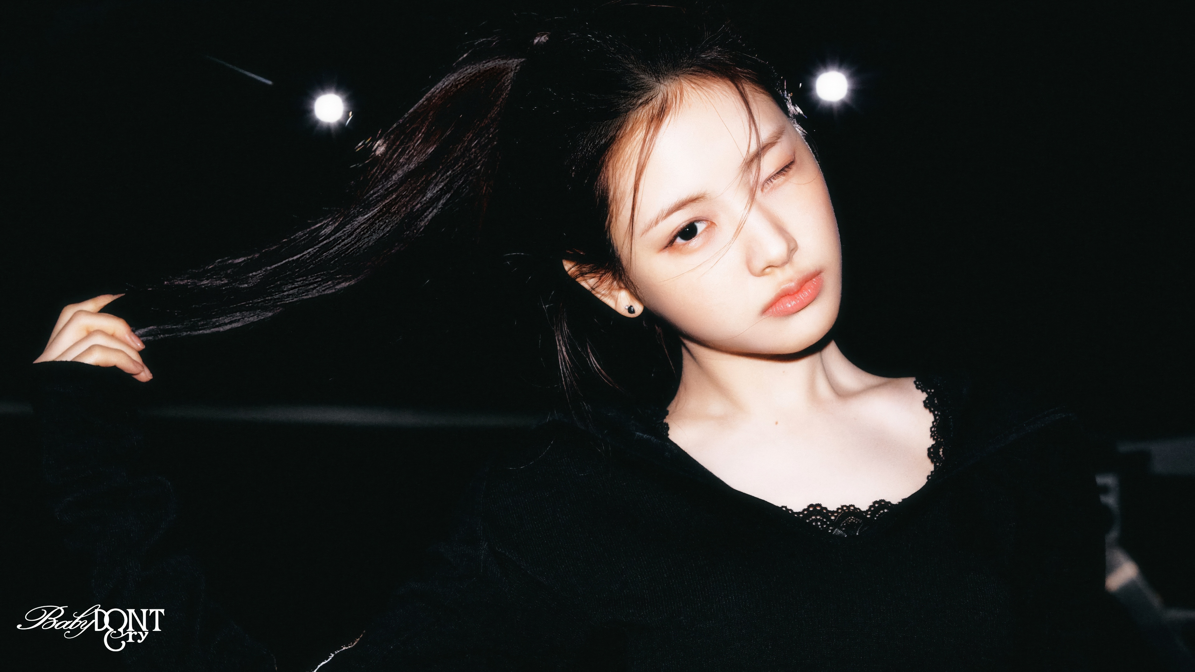 A cinematic 5K portrait of South Korean singer Yihyun featuring a dark, atmospheric background.
