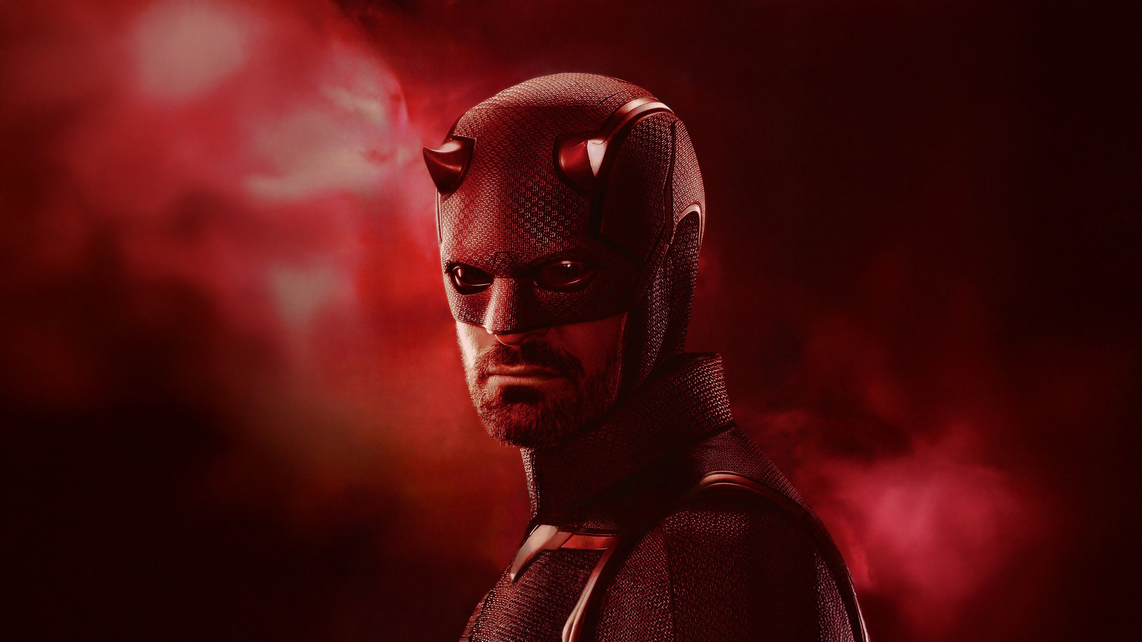 Matt Murdock, played by Charlie Cox, from the series Daredevil: Born Again against a red background