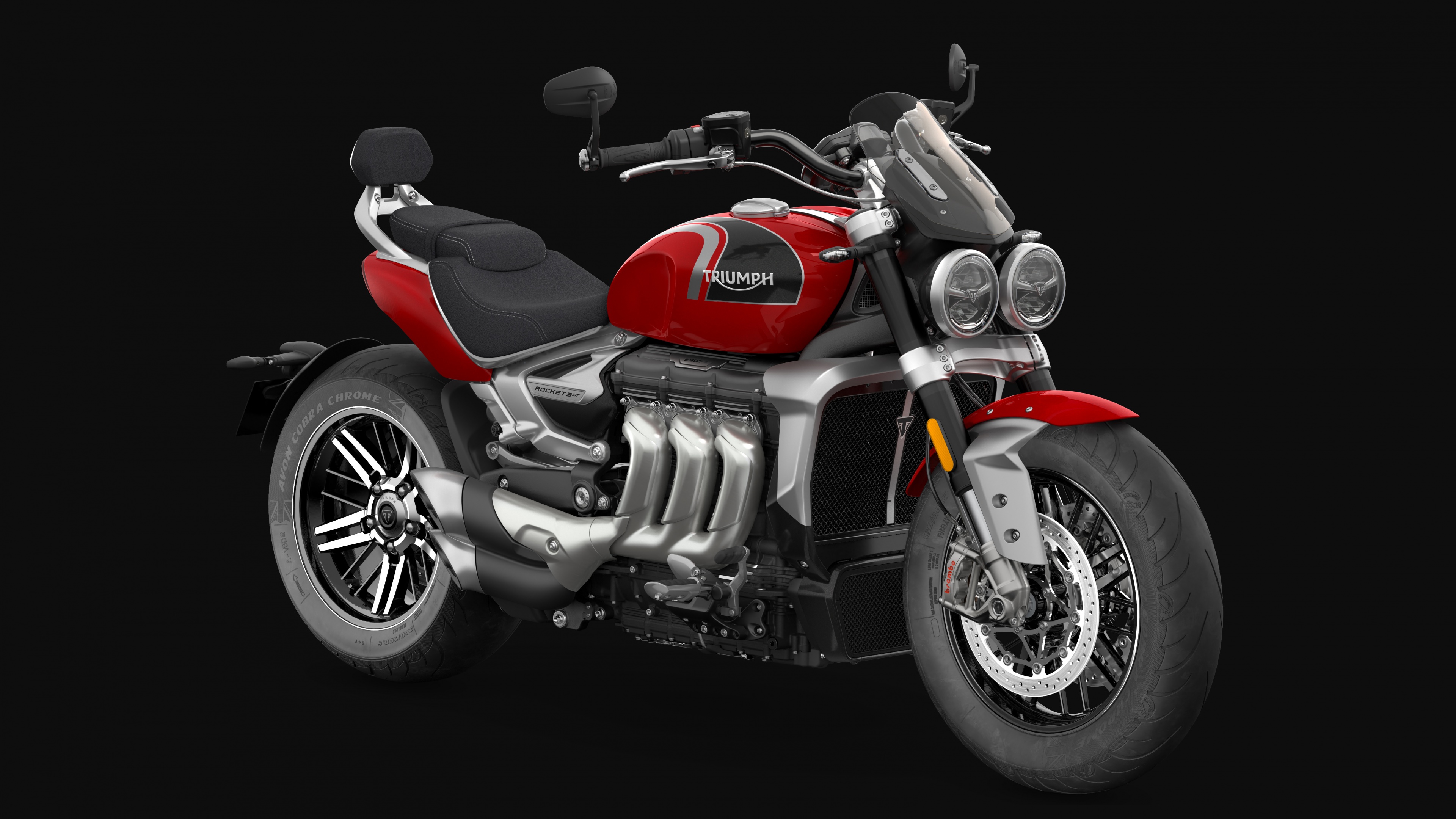 A sleek 2022 Triumph Rocket 3 sports cruiser motorcycle isolated on a black background.