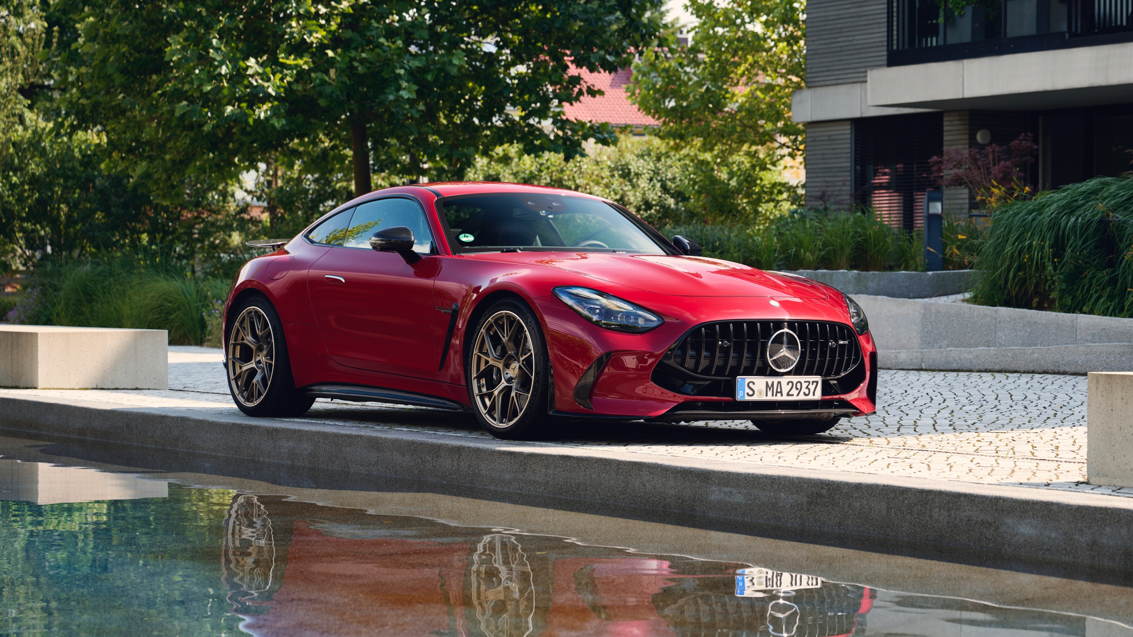 A high-detail shot of a red 2024 Mercedes-AMG GT 63 S E Performance luxury sports car.