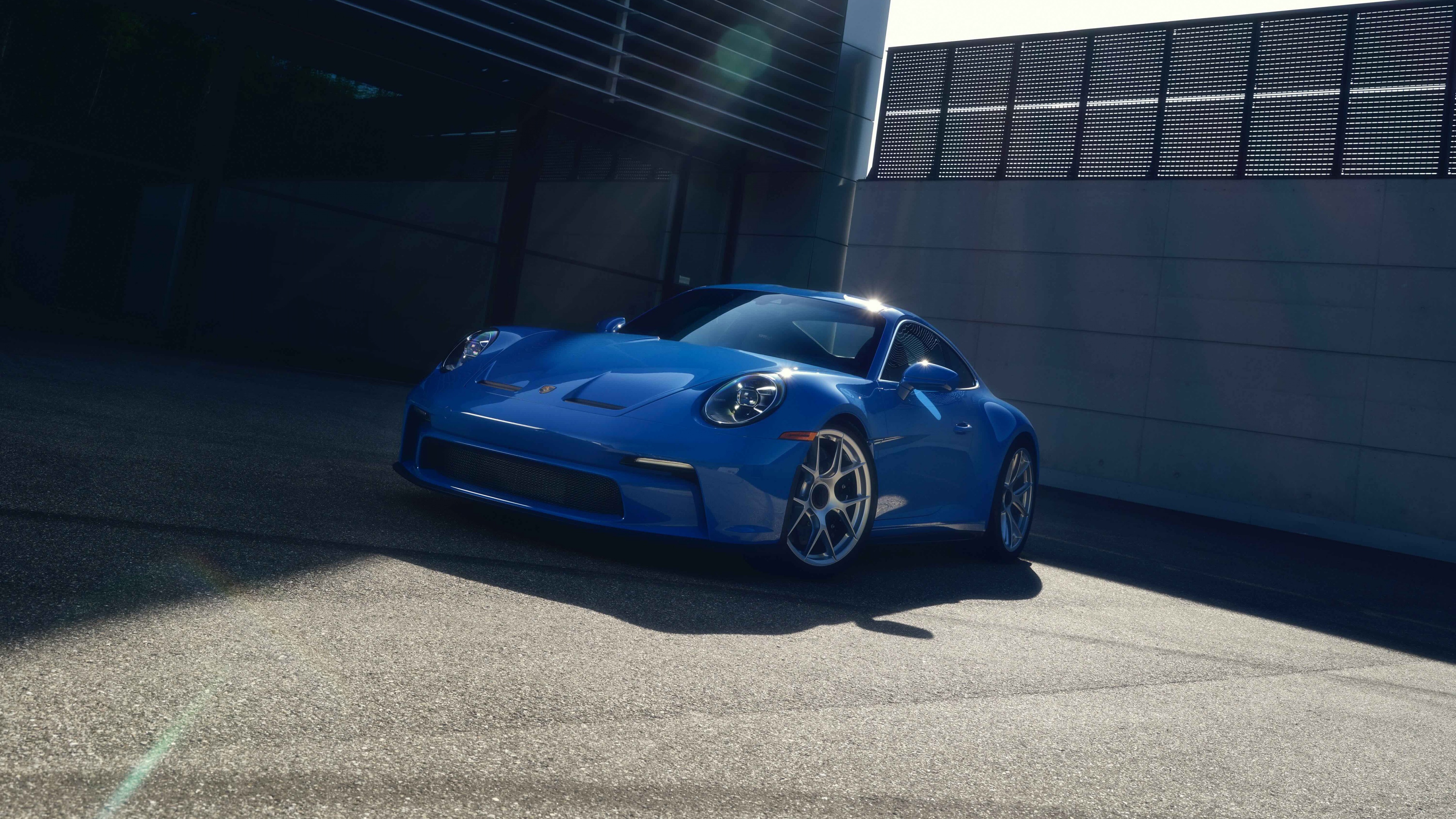 A sleek and polished 2024 Porsche 911 sports car showcasing its modern design and aerodynamic features.