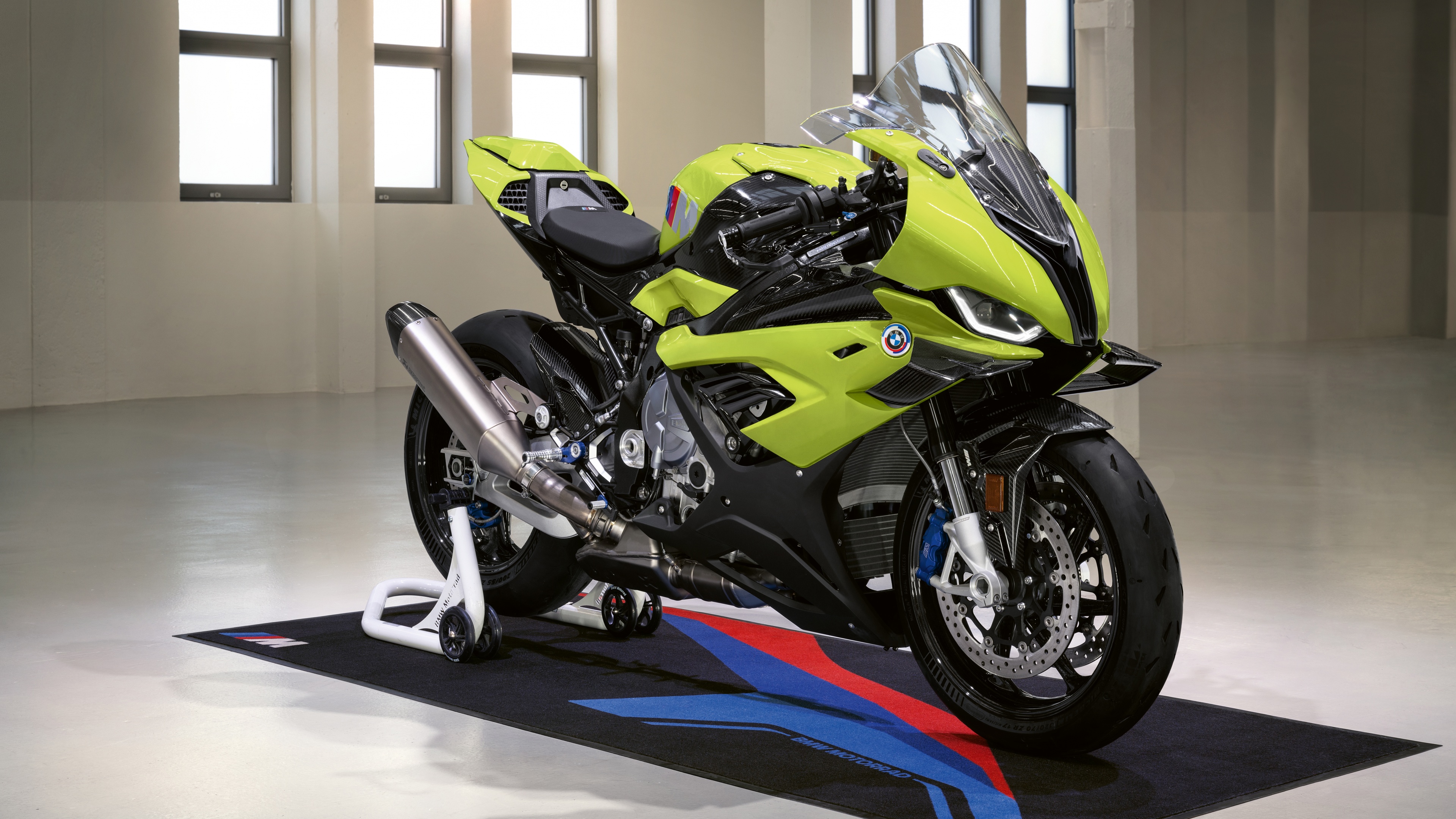 A high-resolution, detailed close-up of the BMW M 1000 RR 50 Years M Anniversary Edition motorcycle featuring classic M performance colors.