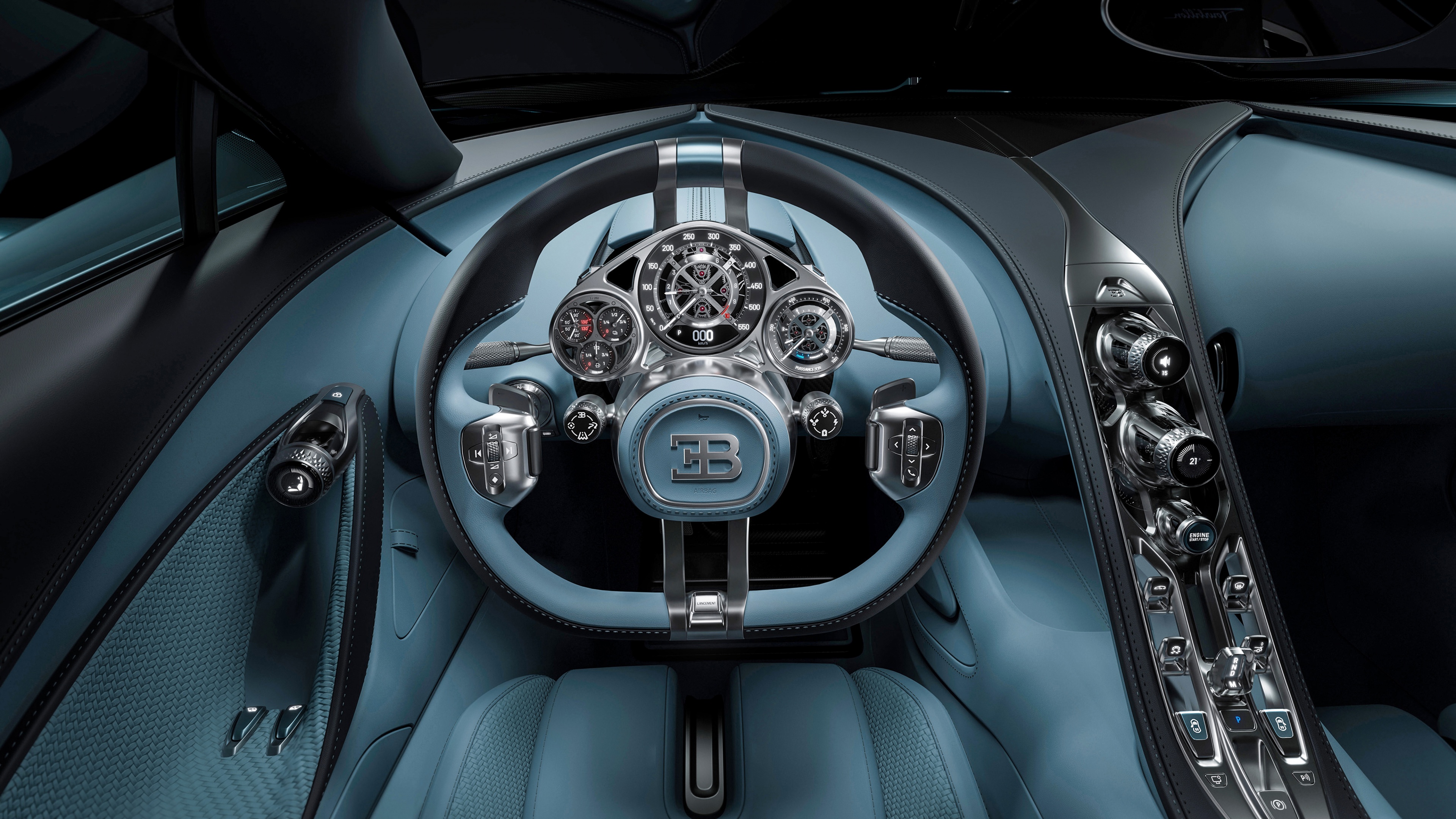 Close-up of the luxurious Bugatti Tourbillon cockpit featuring detailed mechanical dashboard instruments and premium interior materials.
