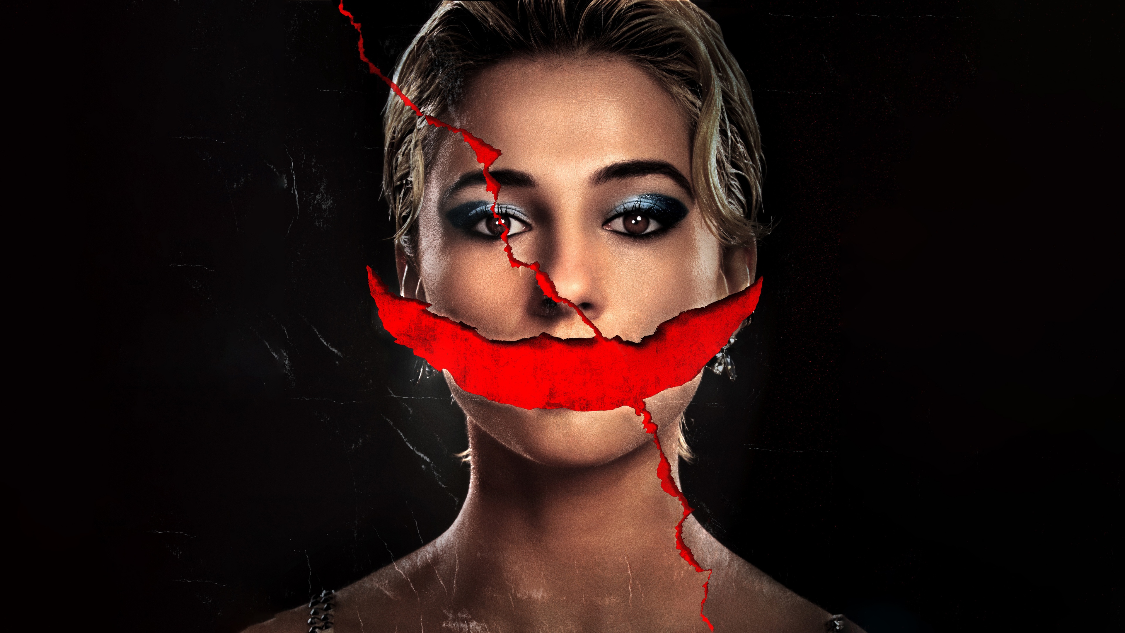 A dramatic and dark-themed portrait of actress Naomi Scott in a horror movie setting.