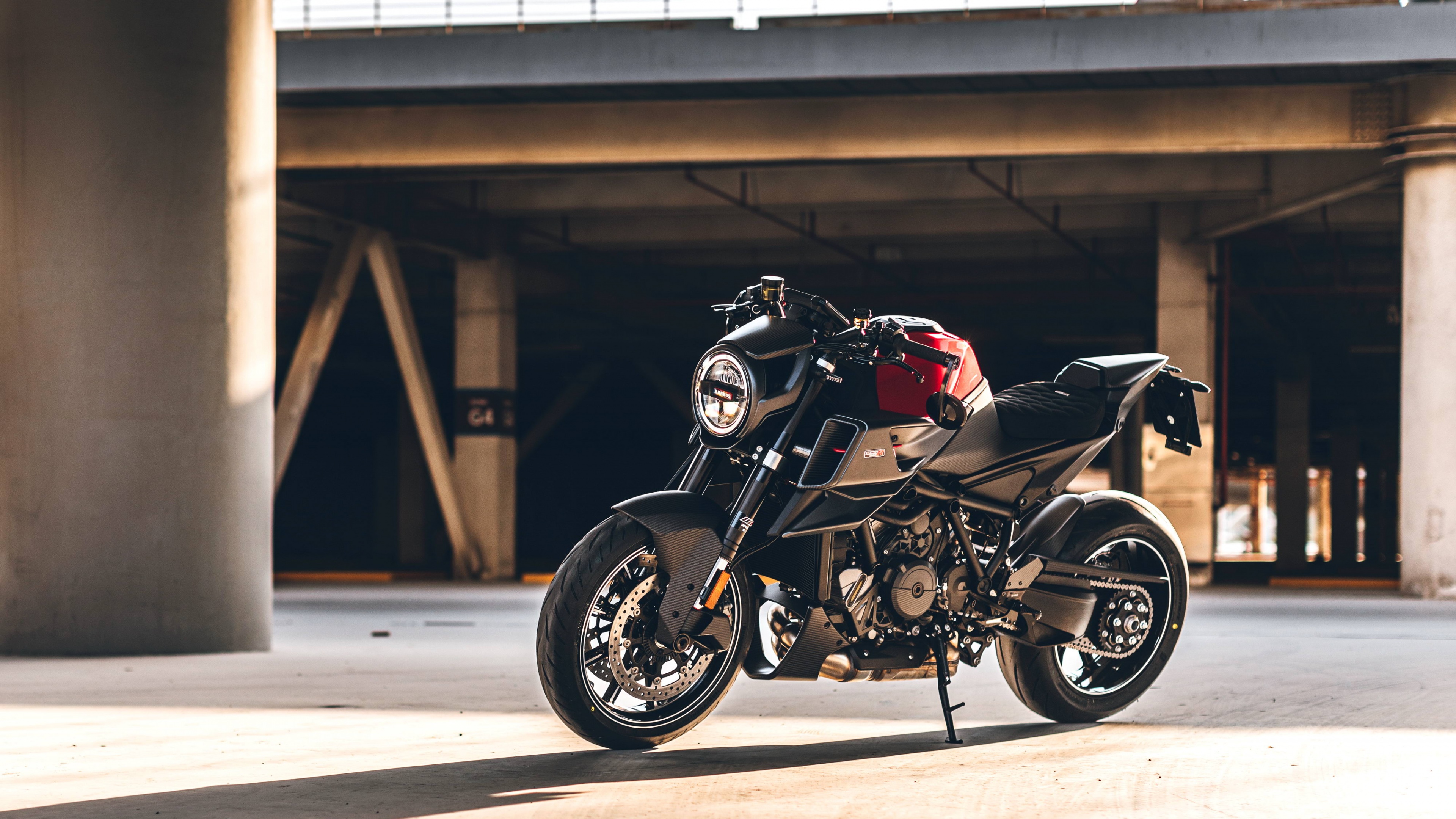 Close-up shot of a 2022 KTM 1290 Super Duke R motorcycle featuring aggressive orange and black styling.