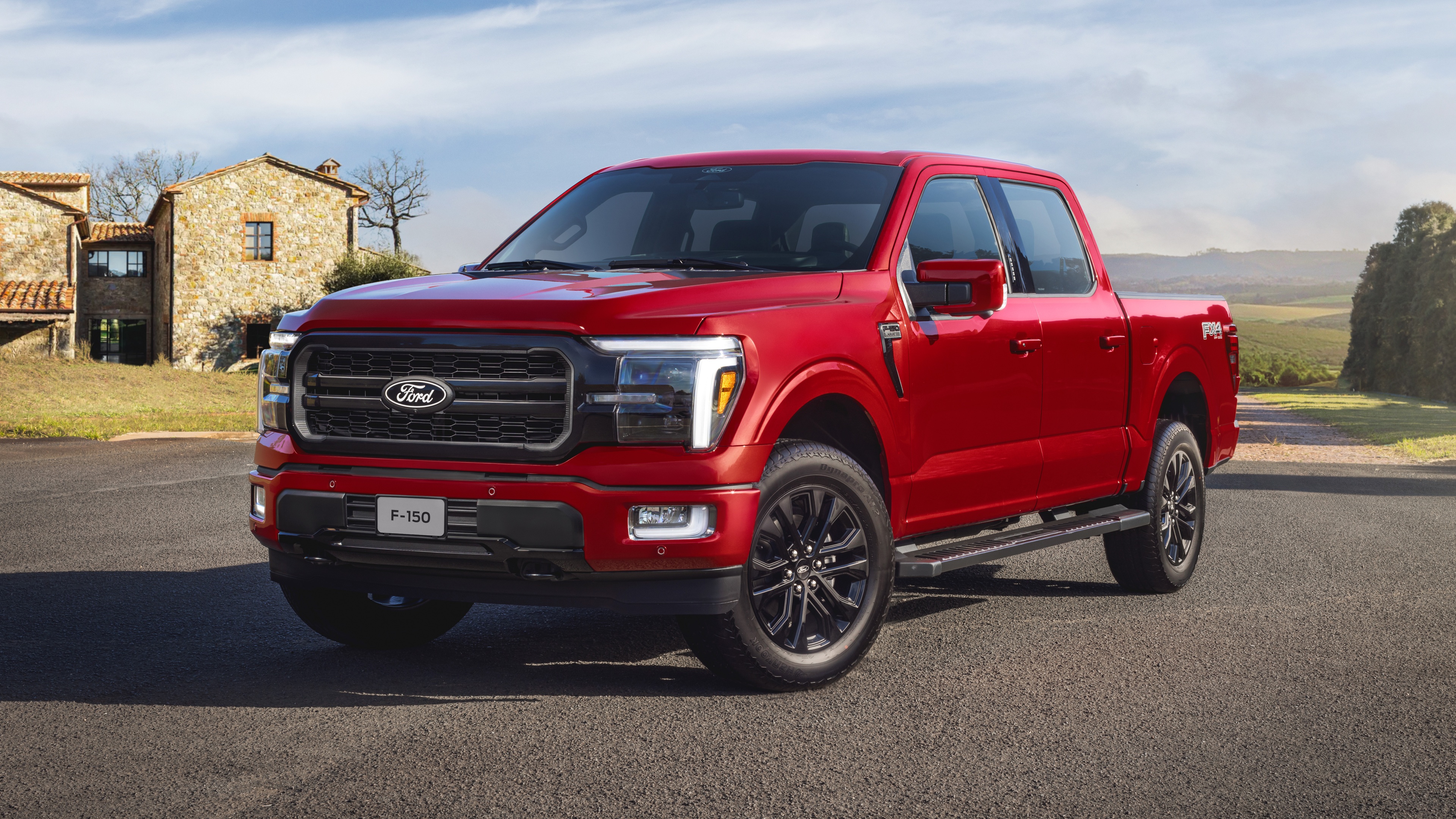 A high-resolution, detailed shot of a Ford F-150 off-road truck navigating tough, rocky terrain.