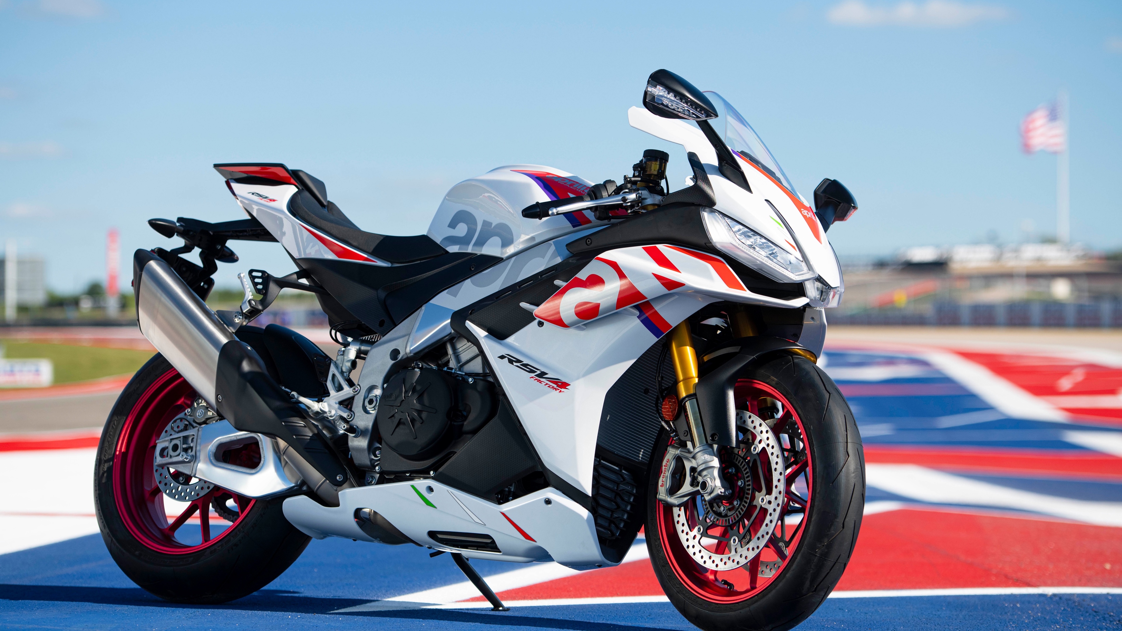 A high-resolution, cinematic shot of an Italian Aprilta RSV4 Factory superbike featuring sleek aerodynamic design.