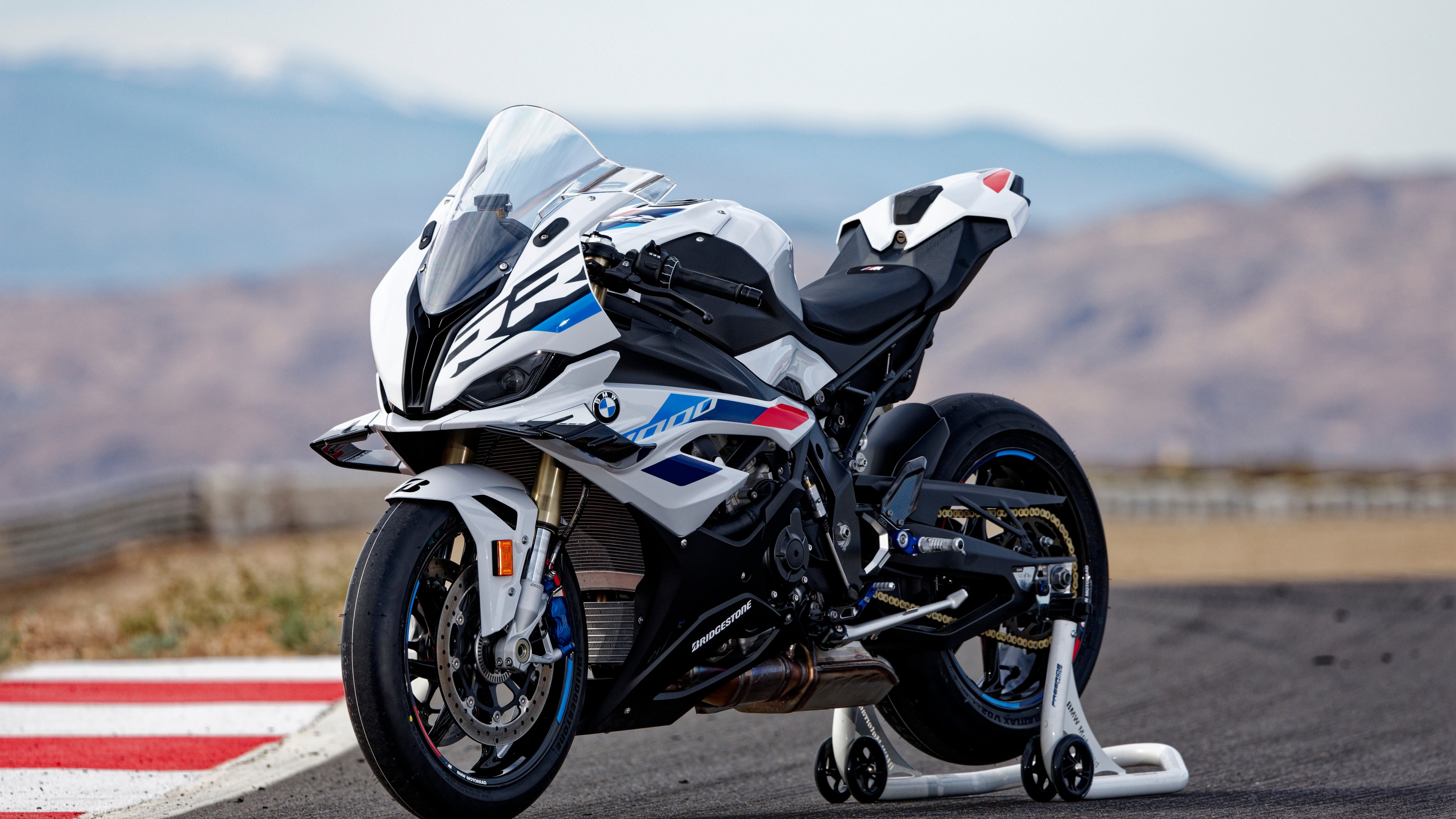 A detailed view of the 2023 BMW S 1000 RR sports motorcycle featuring an aggressive aerodynamic profile and sleek design.