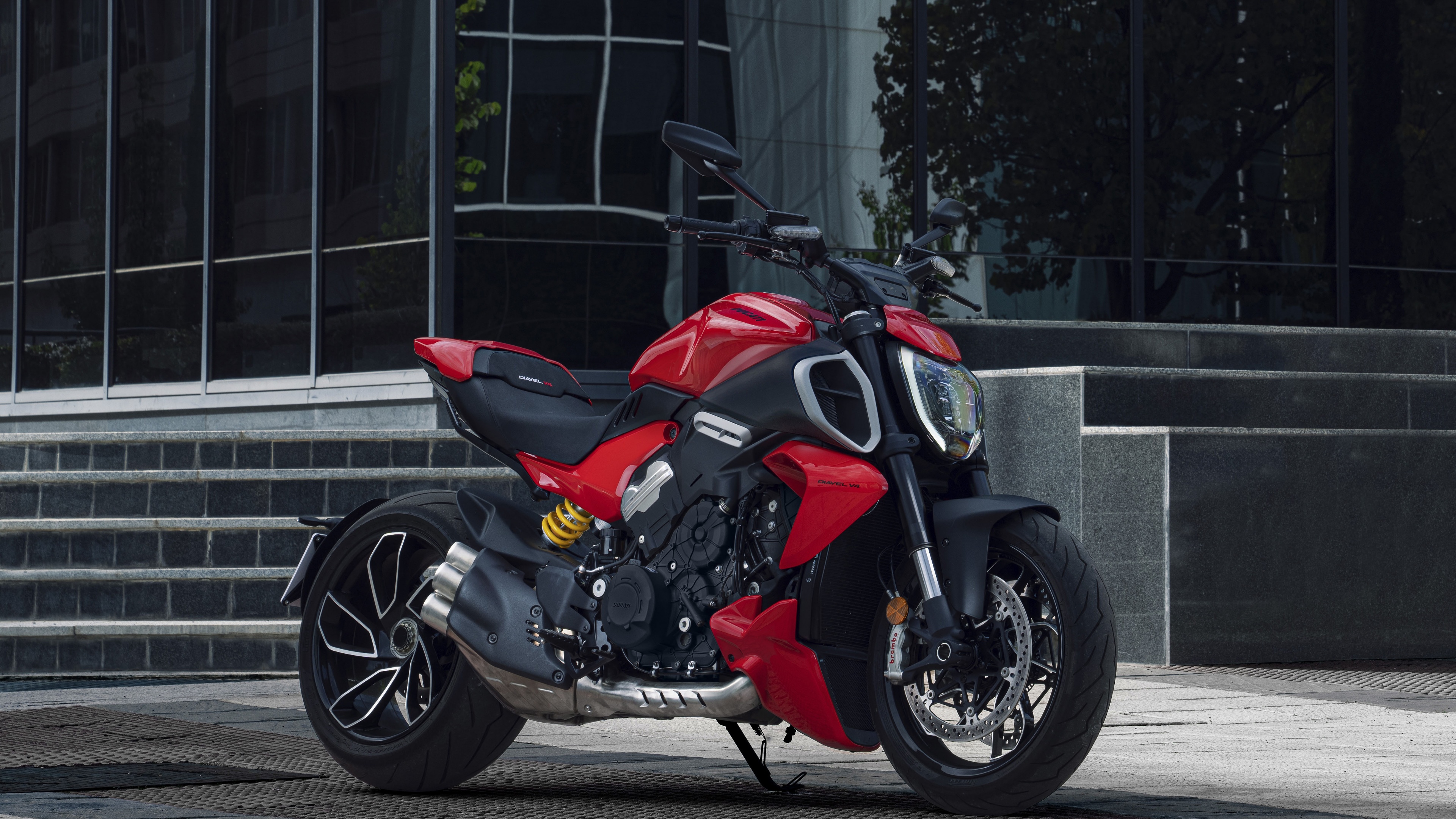 A detailed, cinematic view of the 2023 Ducati Diavel V4 muscle cruiser, emphasizing its aerodynamic design and robust engine components.