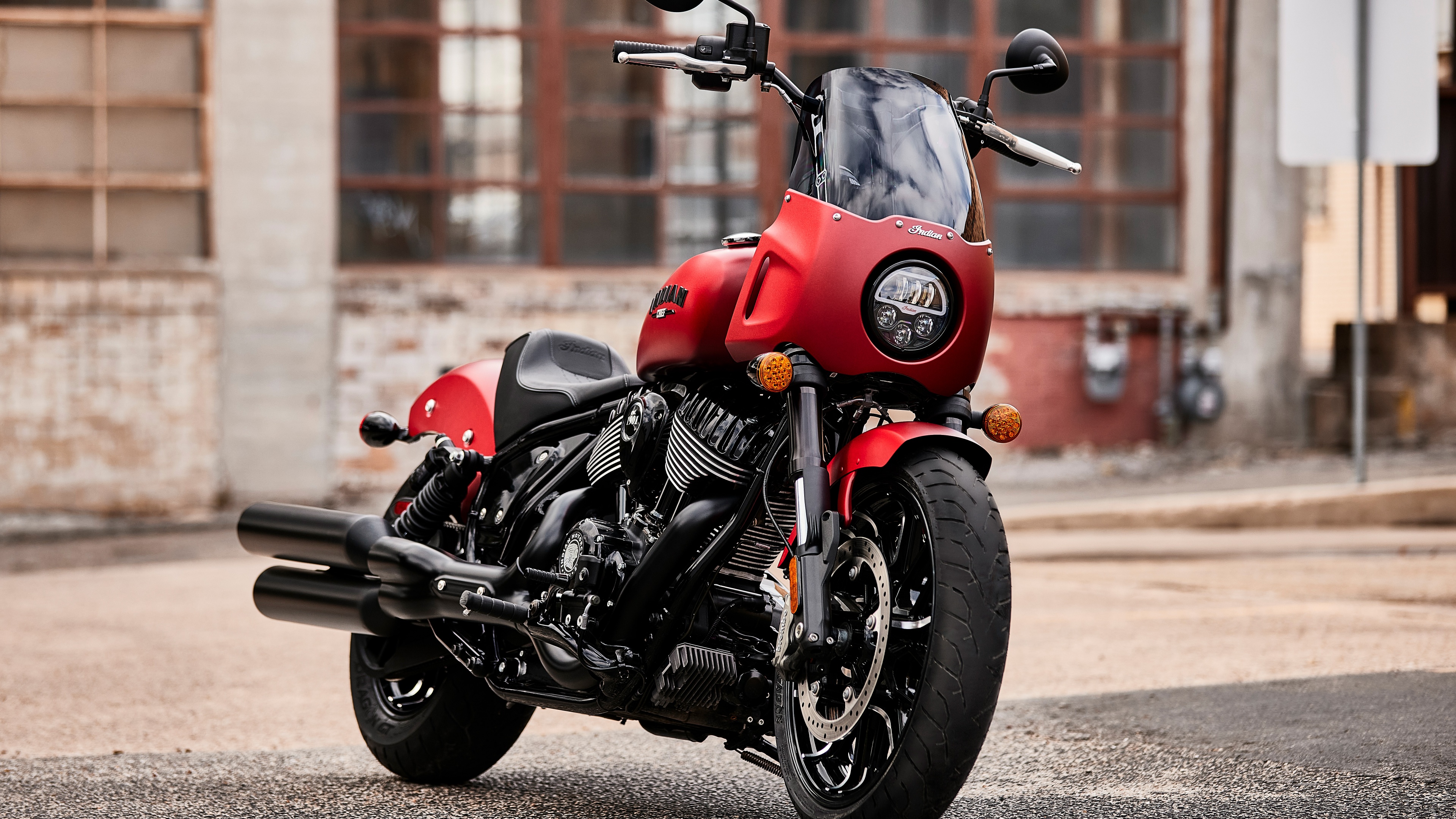 A detailed close-up of a 2023 cruiser motorcycle showcasing chrome components and a modern metallic finish.