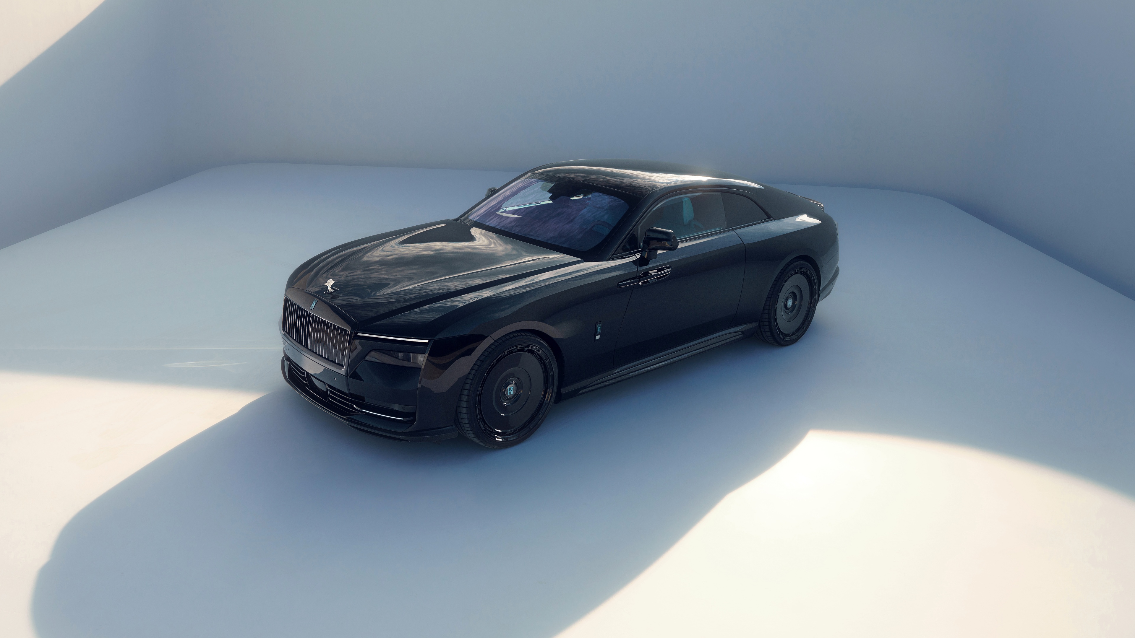 A high-resolution cinematic shot of a 2024 Rolls-Royce Spectre with SPOFEC body styling, highlighting its sleek luxury electric coupe design.
