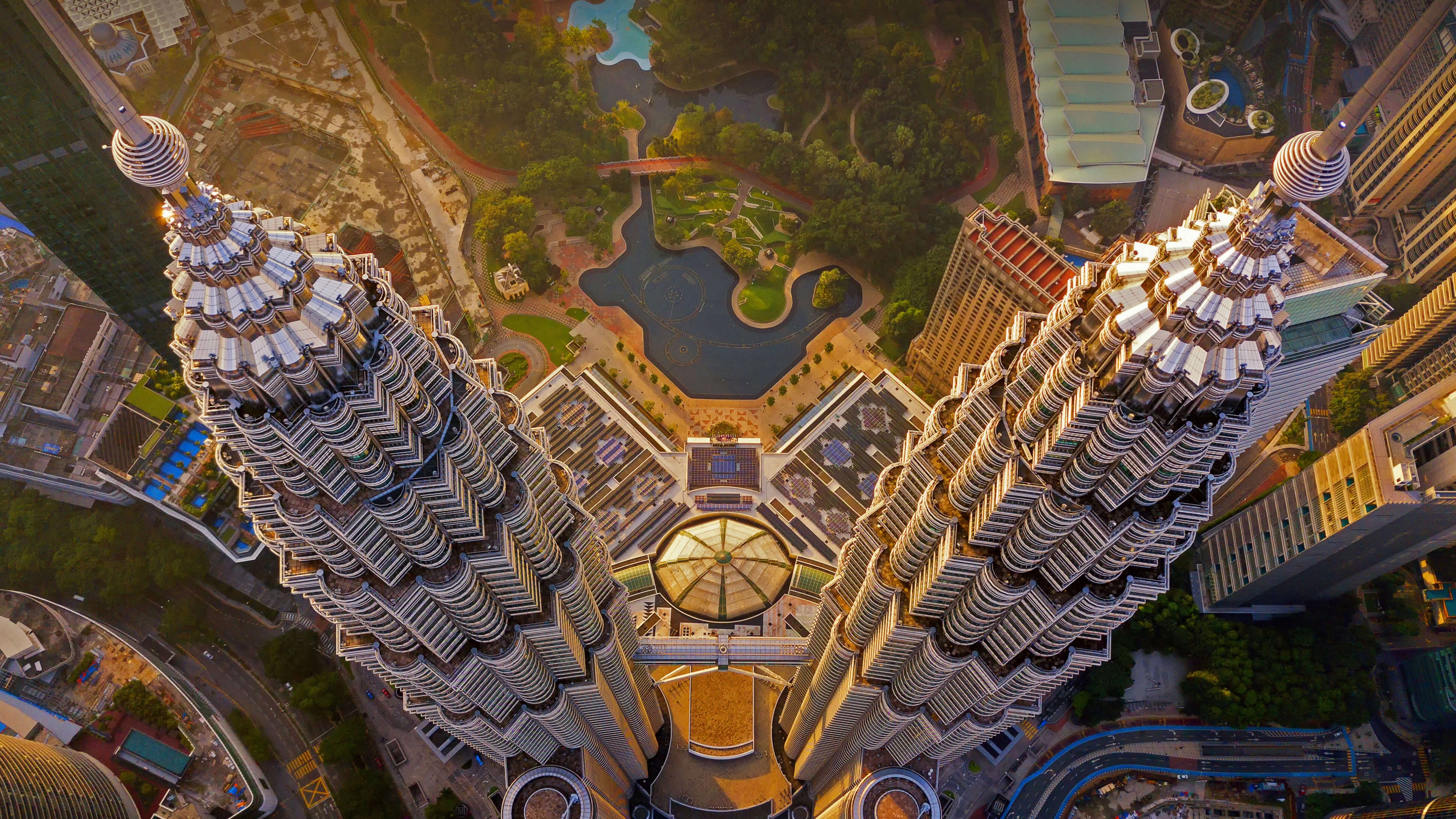 An aerial view of the Petronas Twin Towers and the skyscraper skyline of Kuala Lumpur, Malaysia.