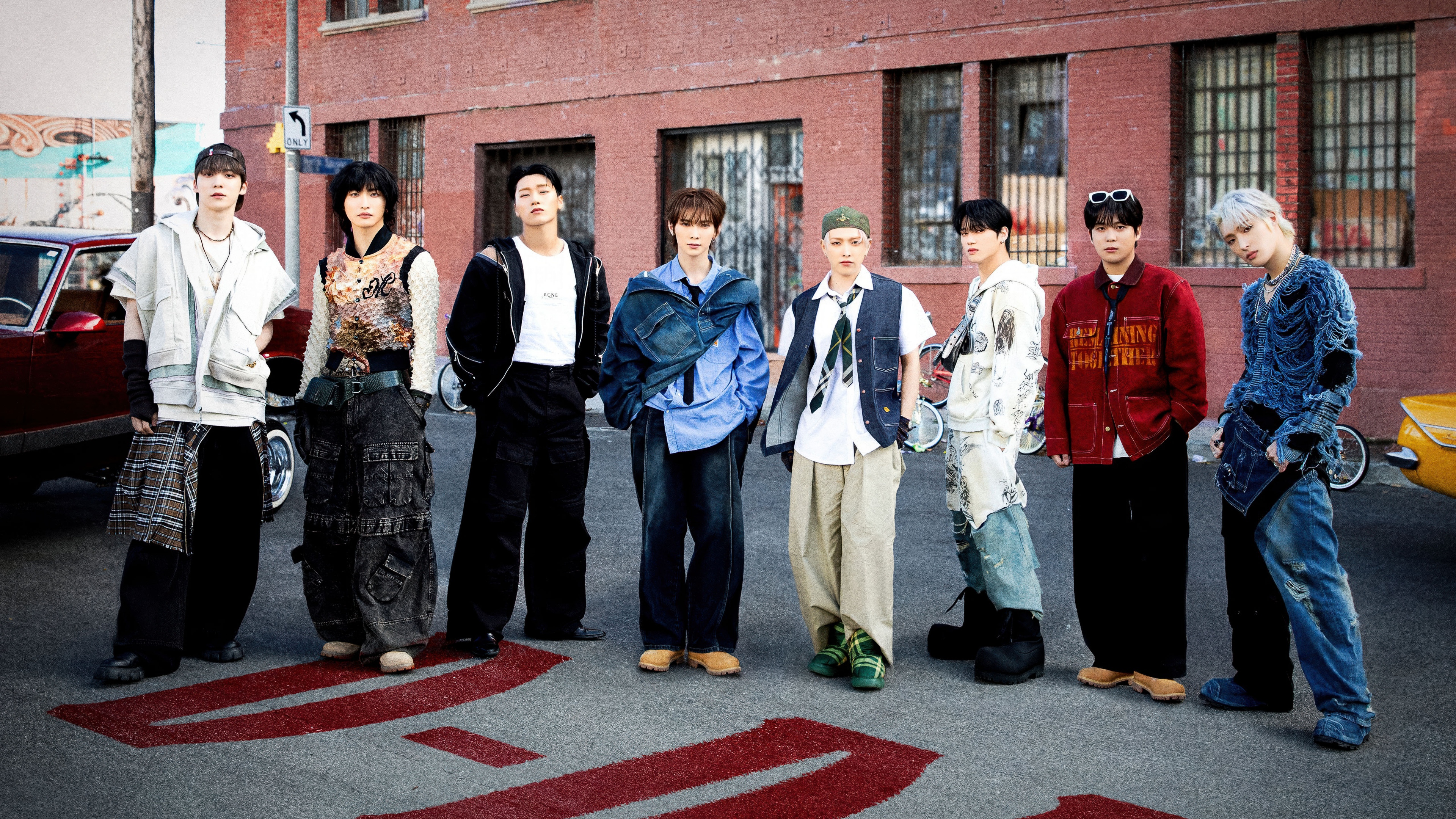 A high-quality group portrait of the K-Pop boy group ATEEZ, featuring members Hongjoong, Seonghwa, Yunho, Yeosang, San, Mingi, Wooyoung, and Jongho.
