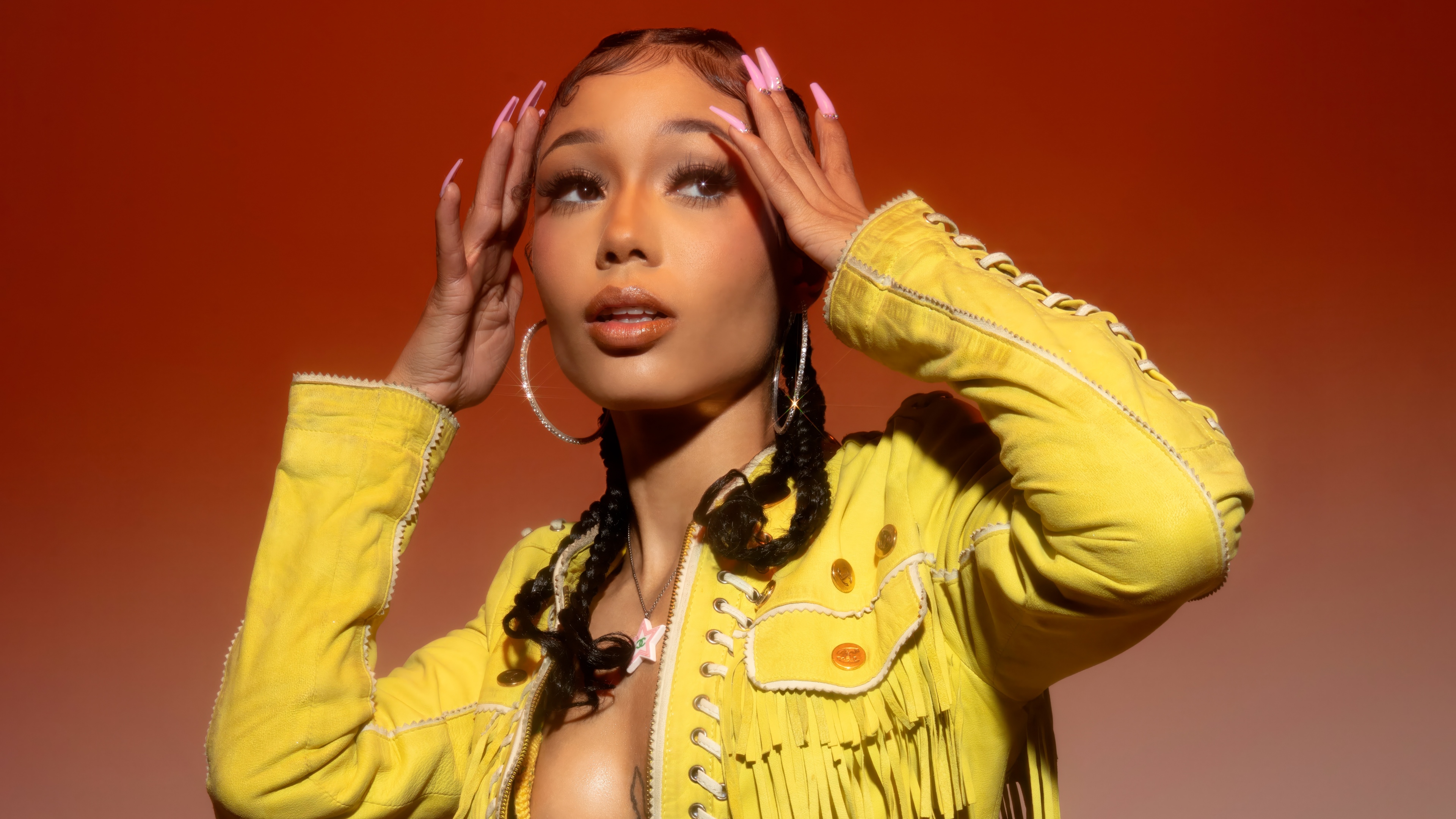 A detailed close-up portrait of an American rapper against a vivid red background.