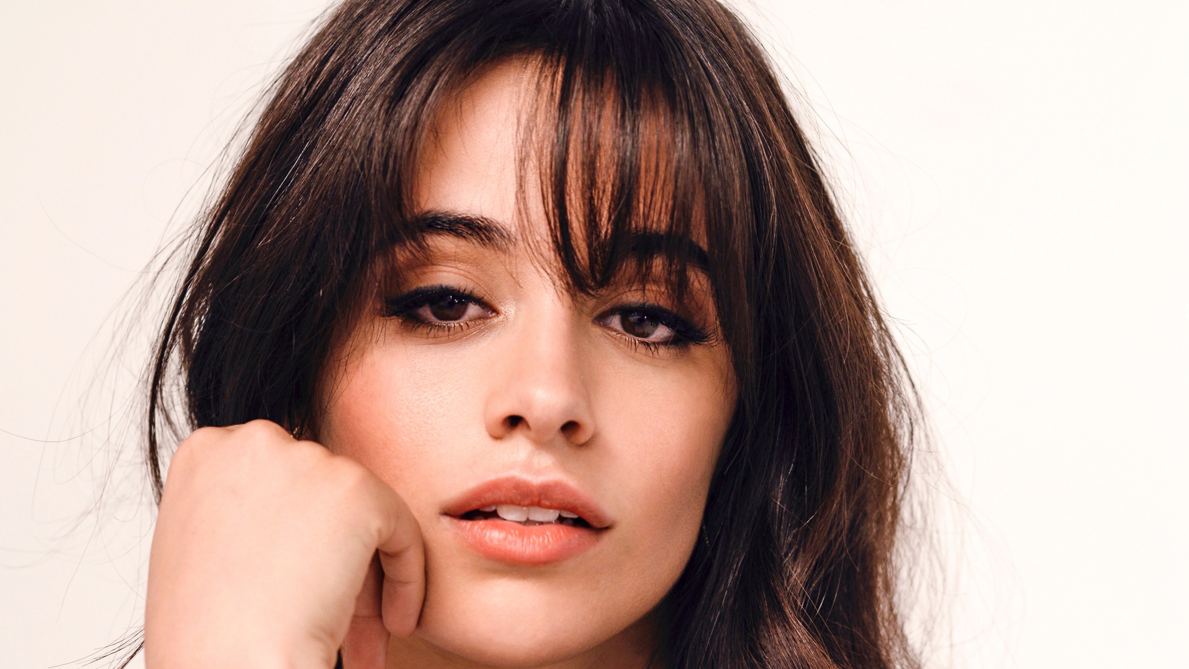 A detailed photographic portrait of singer Camila Cabello.