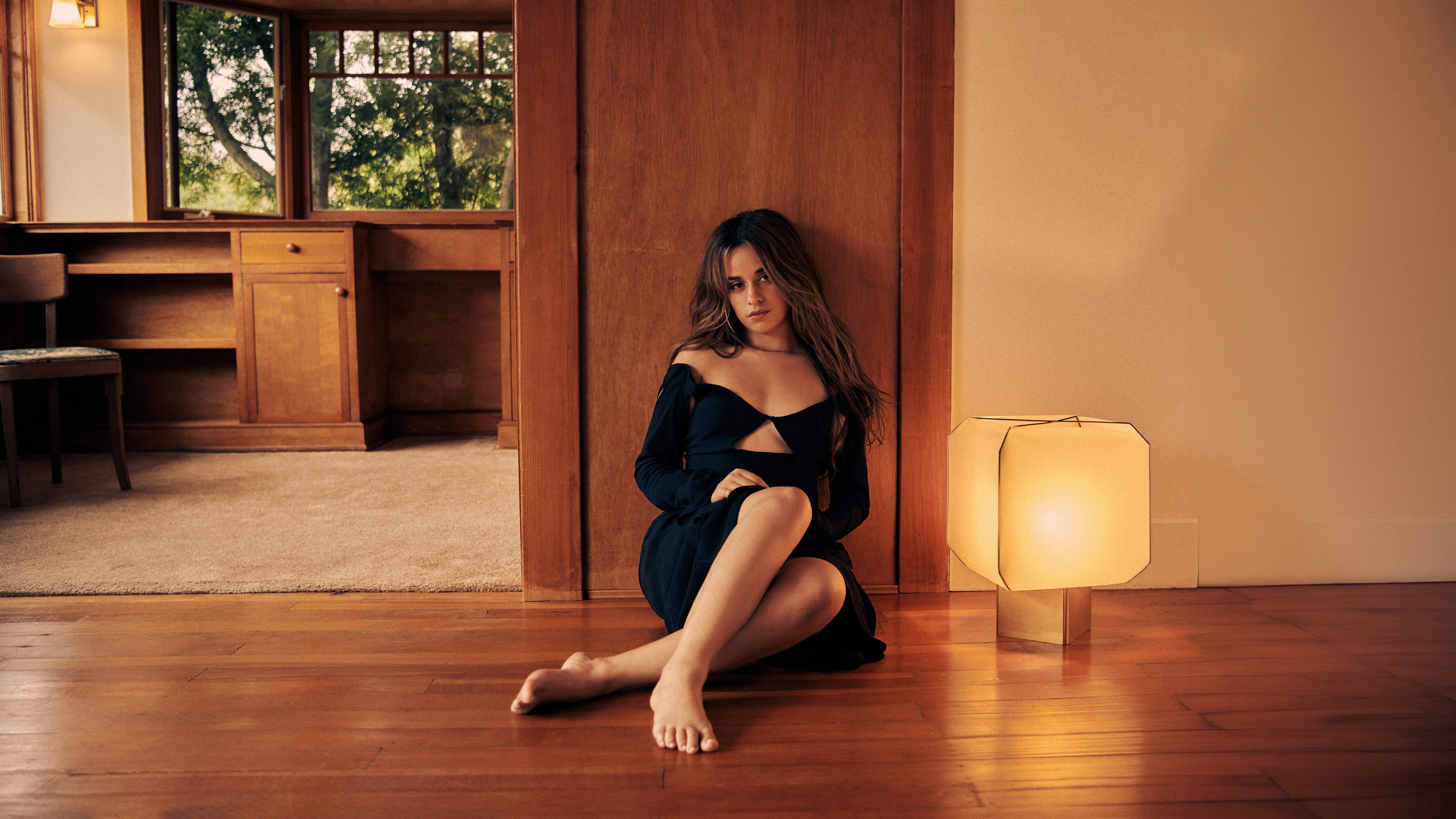 Camila Cabello posing for a high-fashion Vogue editorial photoshoot with elegant lighting and styling.