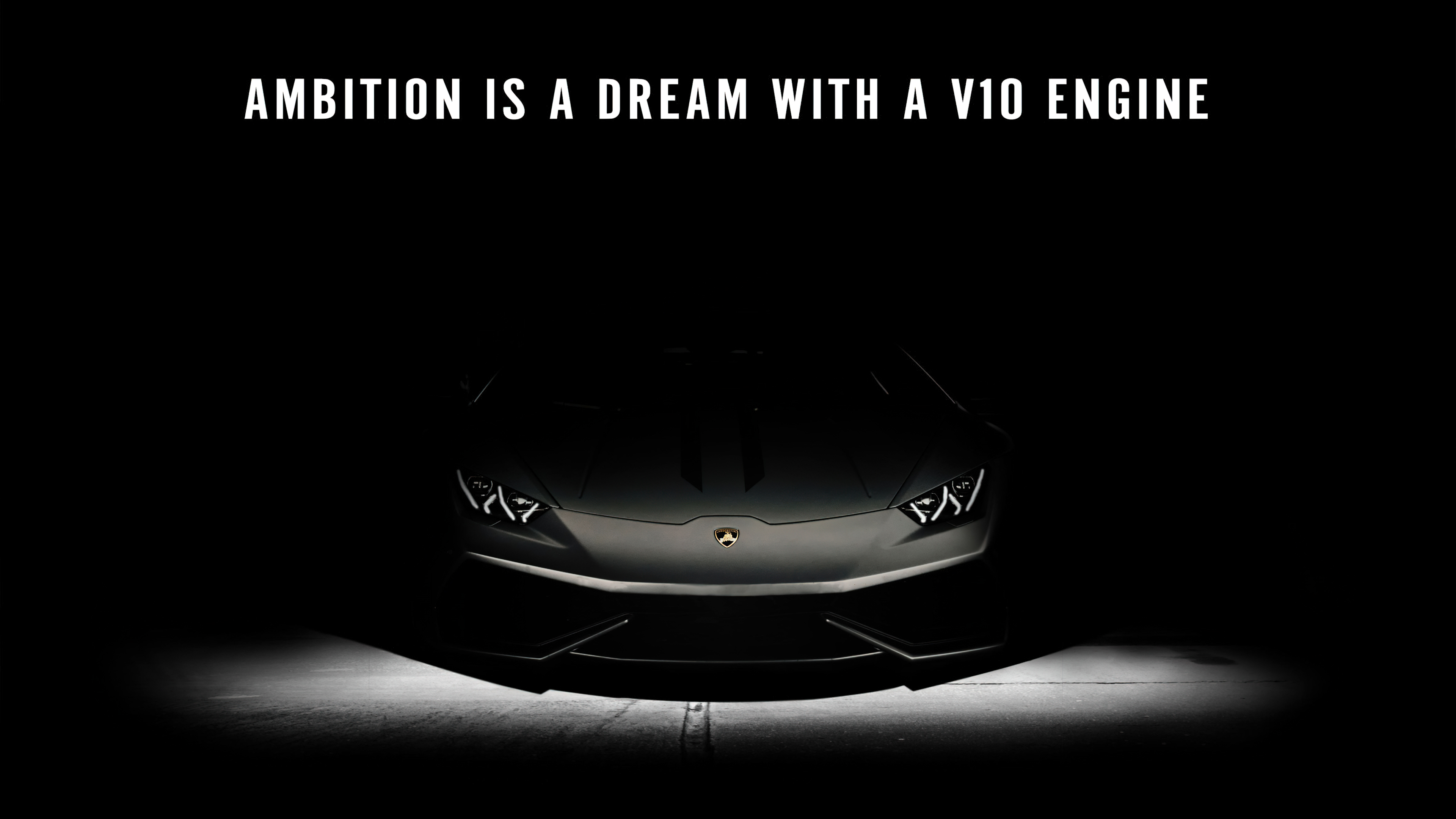 A sleek Lamborghini Huracan parked in a dark, atmospheric setting representing motivation and success.