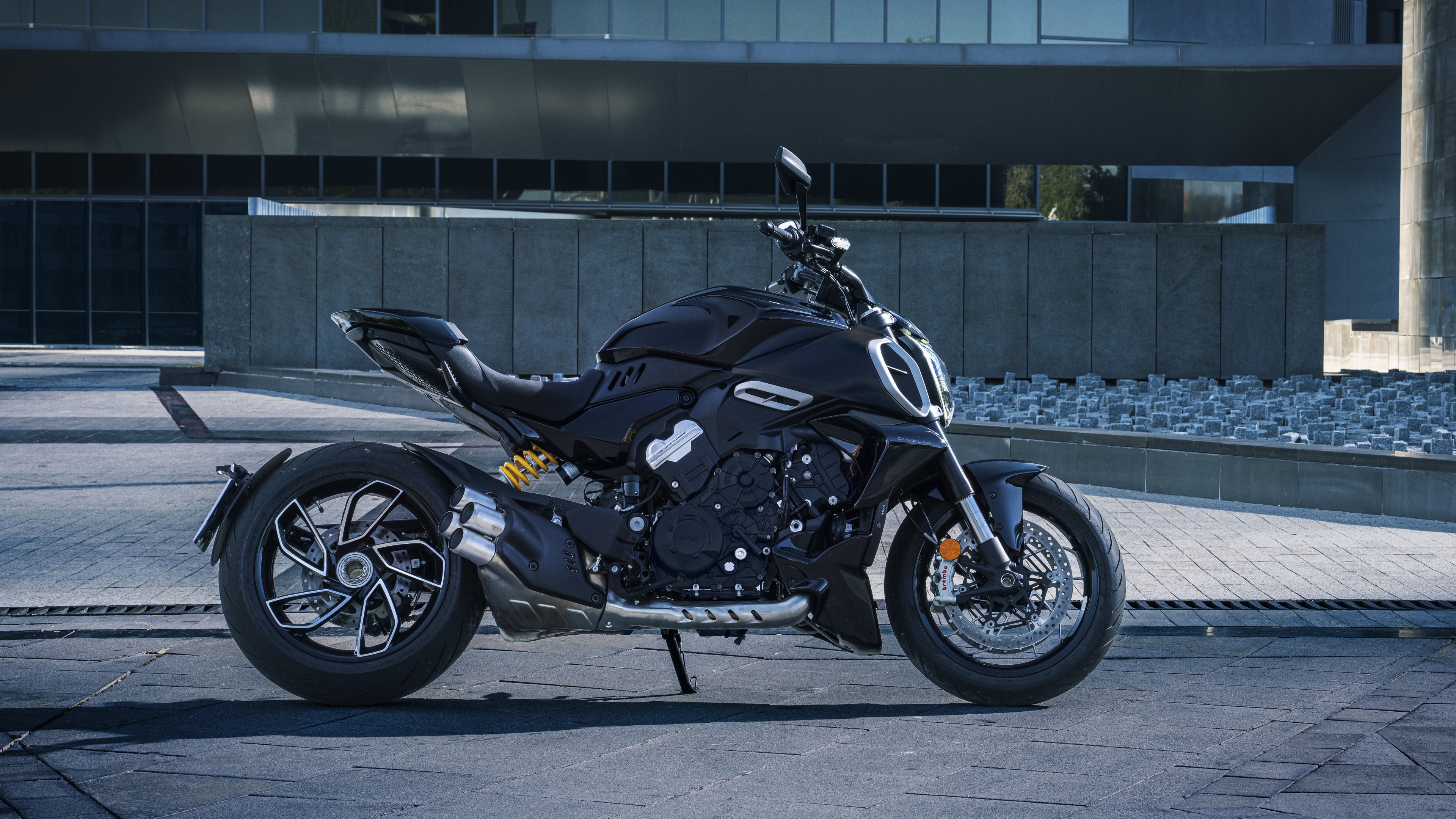A high-detail, cinematic shot of a 2023 Ducati Diavel V4 muscle cruiser motorcycle.