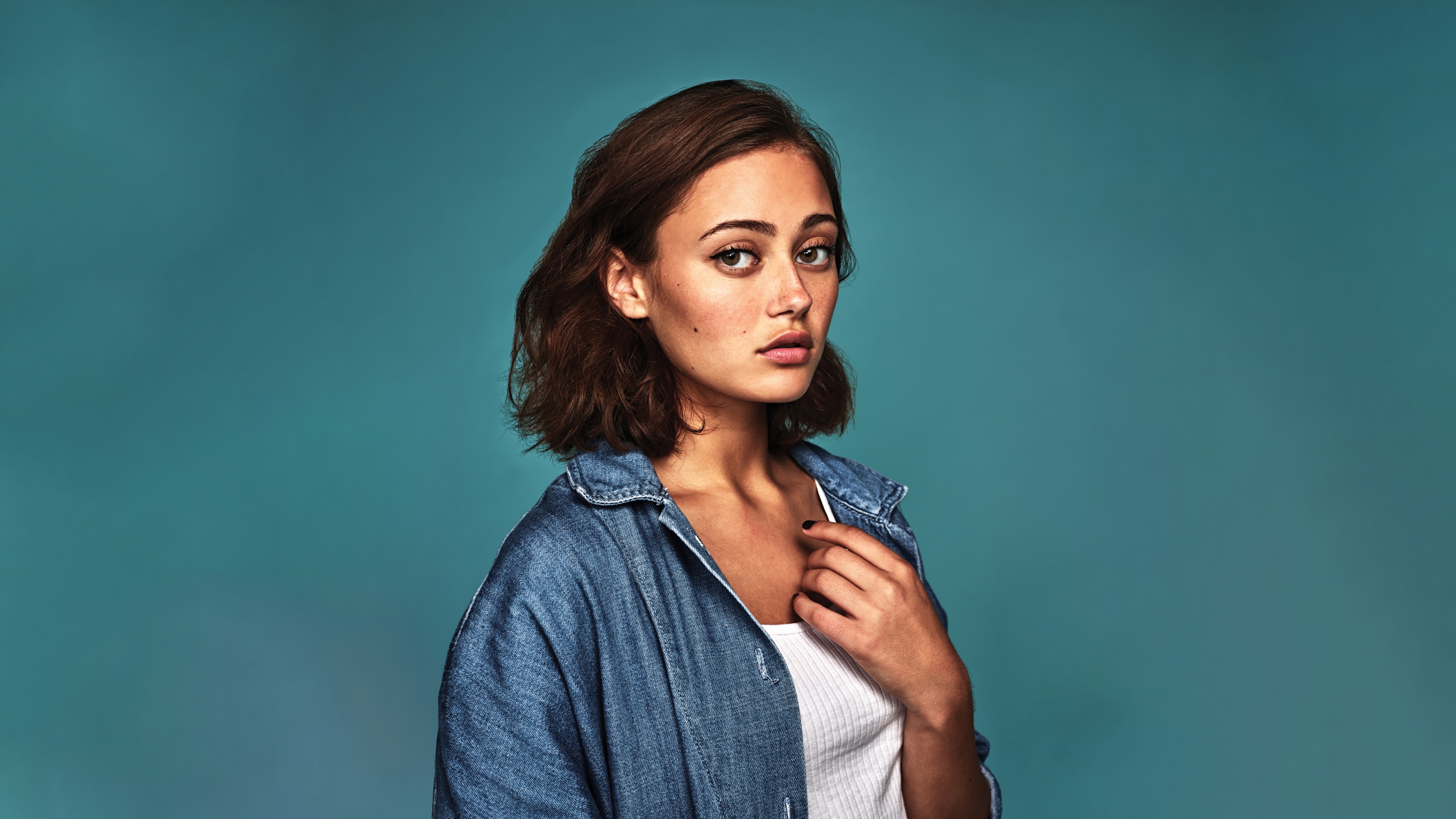 A high-resolution portrait of English actress Ella Purnell with a pastel cyan color aesthetic.