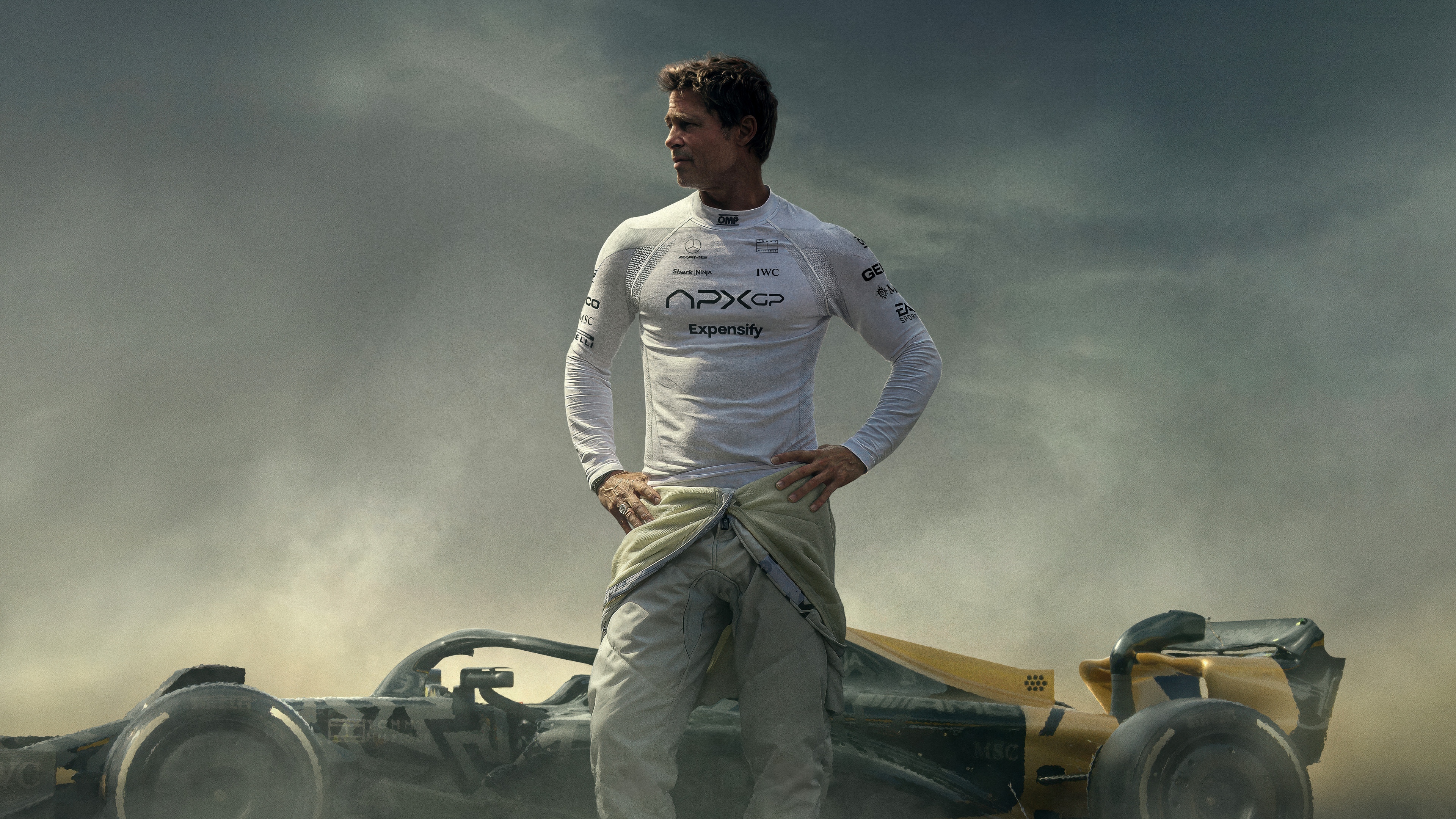 A cinematic movie poster for the 2025 film F1 featuring Brad Pitt as a professional racing driver.