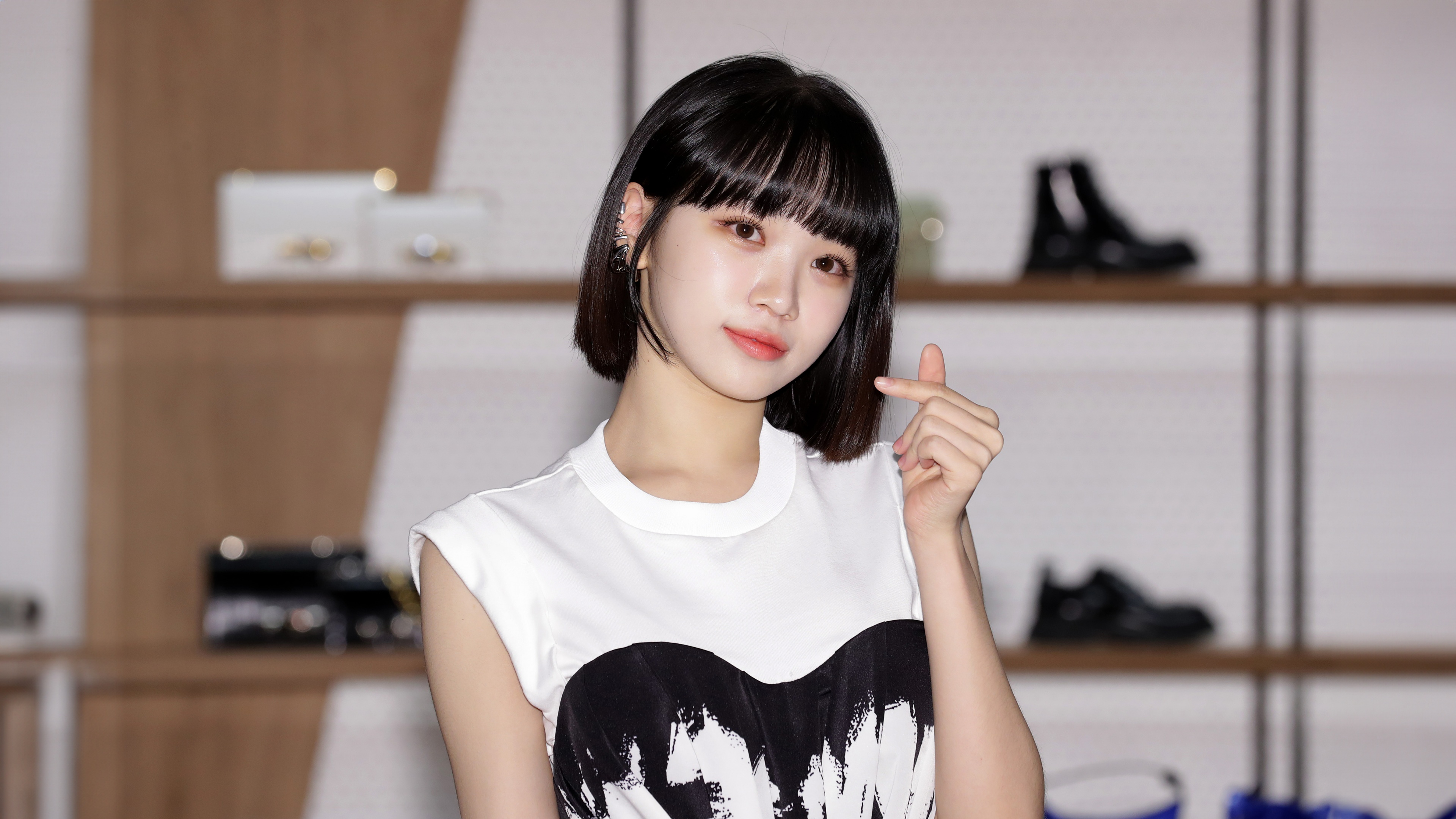 Kim Chaewon from Le Sserafim making a cute finger heart gesture