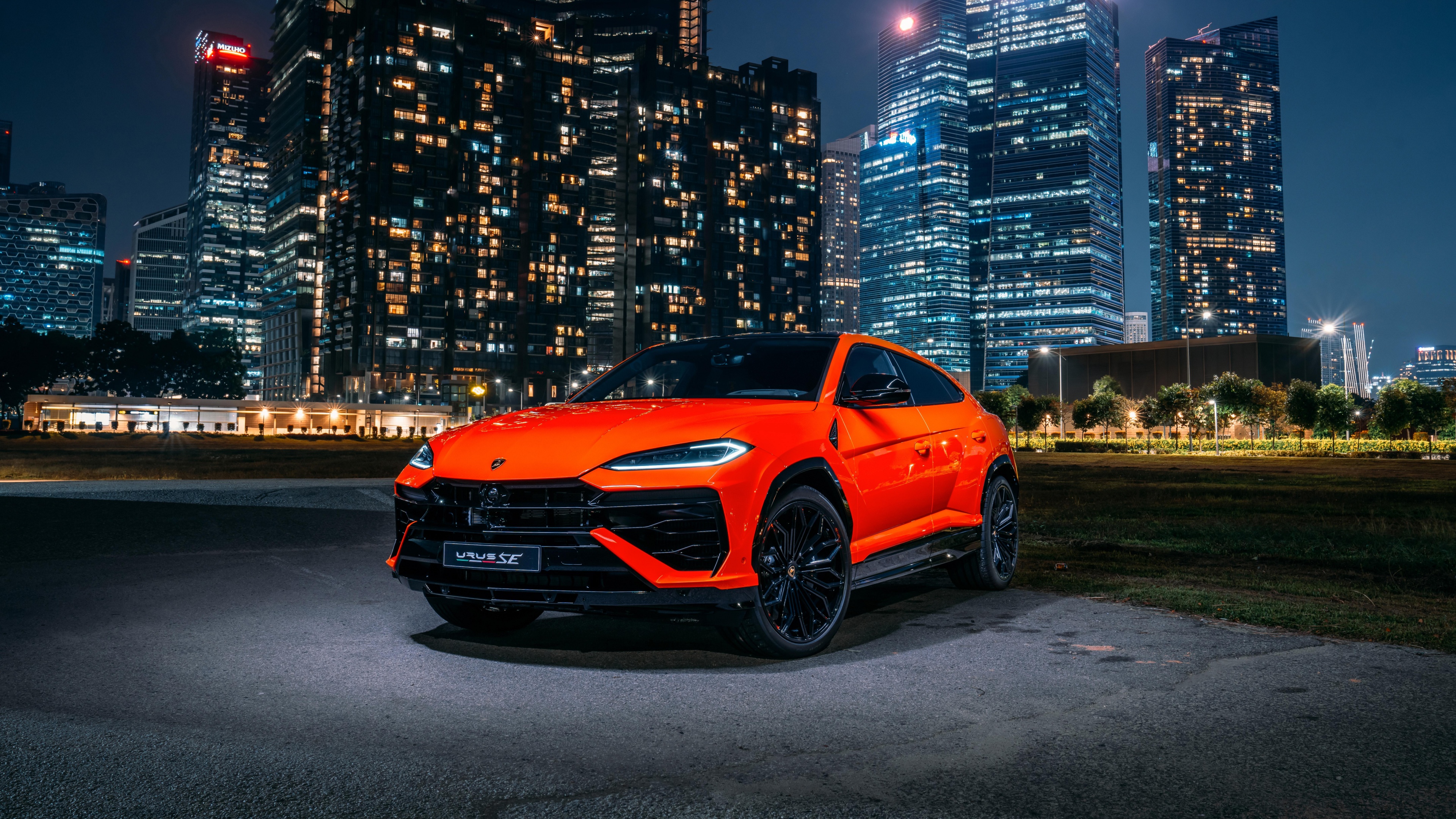 Lamborghini Urus SE Plug-in Hybrid SUV parked in a modern Singapore street.