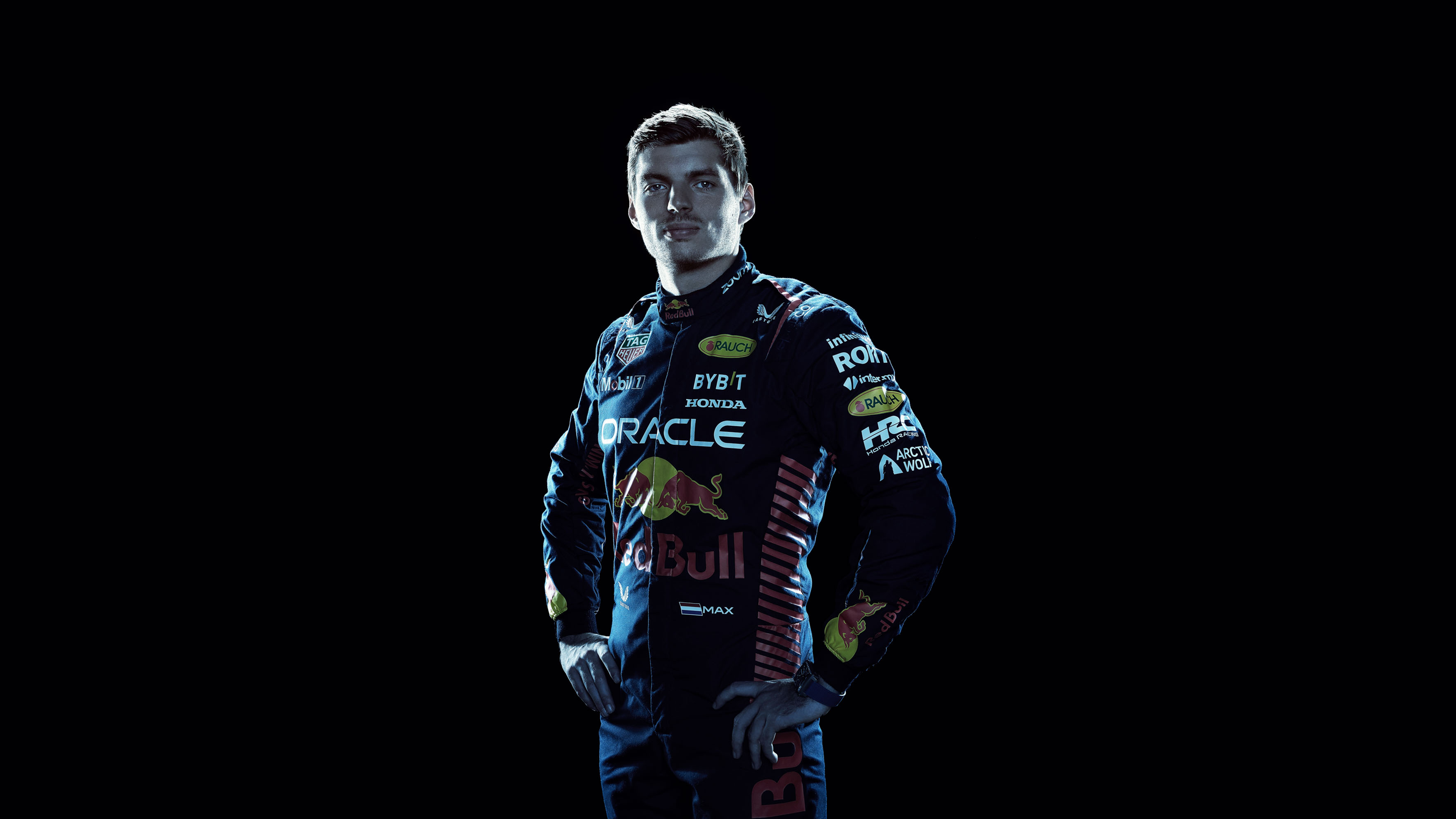 A high-contrast AMOLED portrait of Max Verstappen wearing Red Bull Racing gear against a pitch-black background.