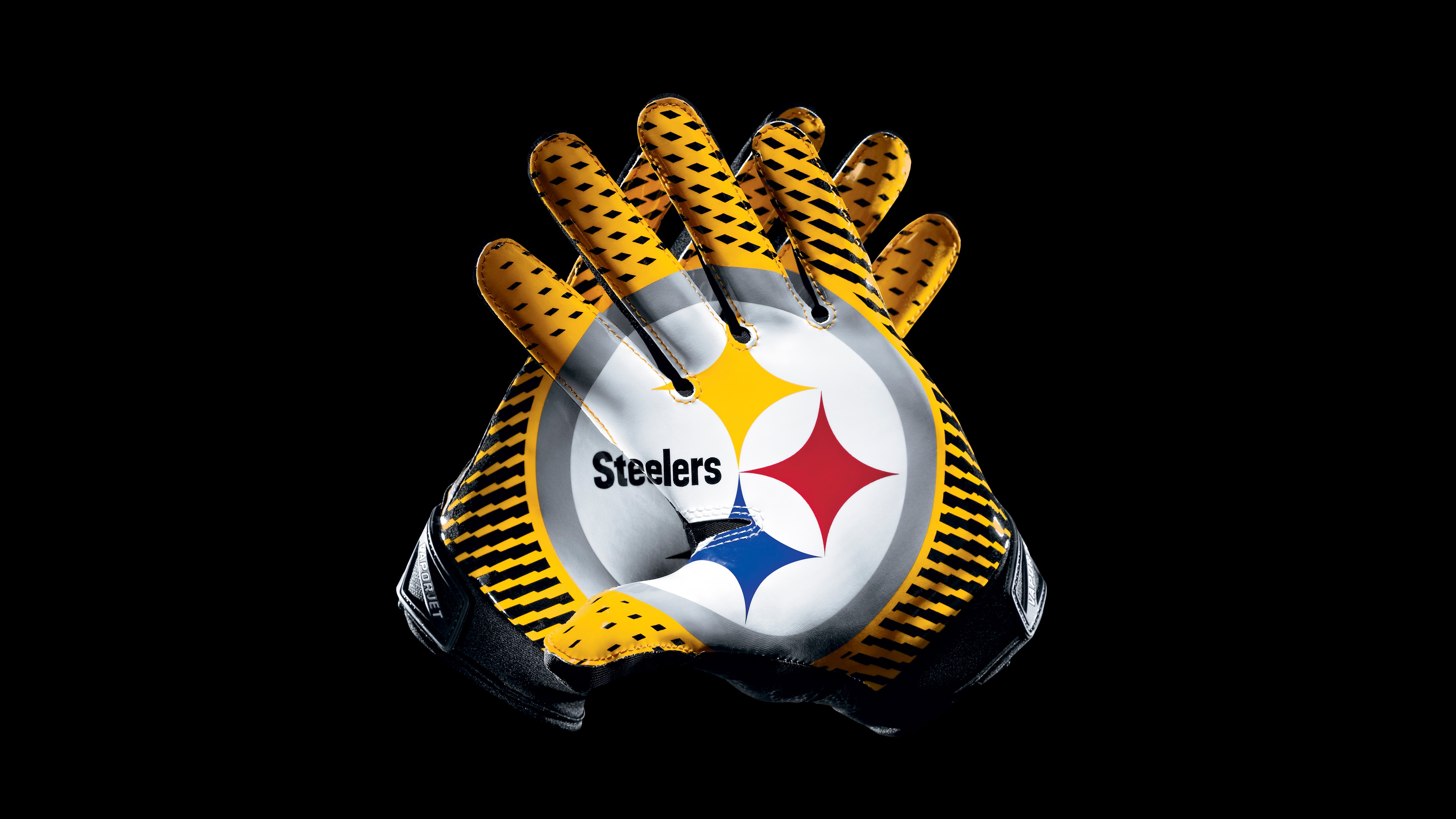High-detail view of Pittsburgh Steelers NFL gloves on a black background