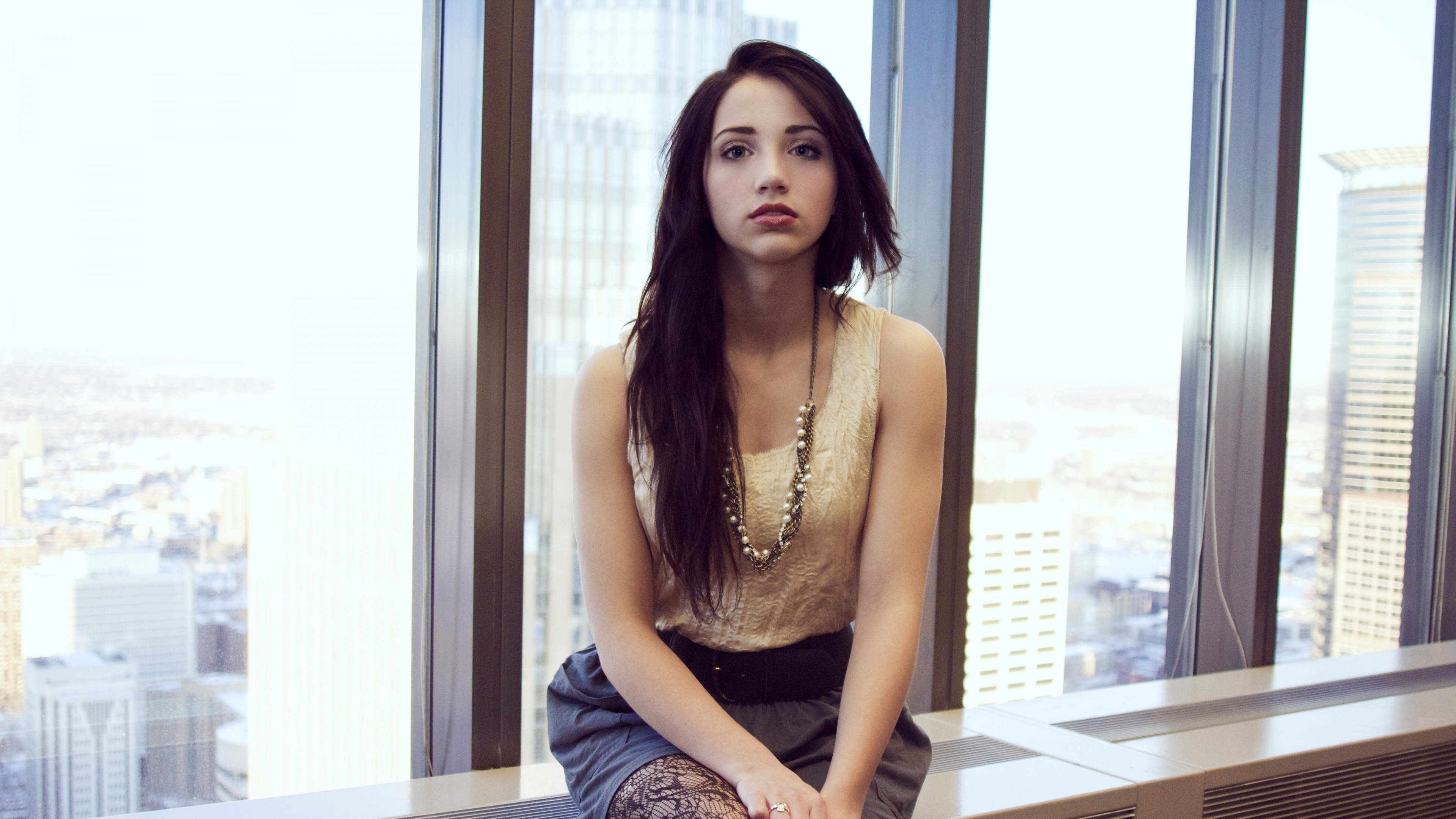 A high-resolution, detailed close-up portrait of actress Emily Rudd