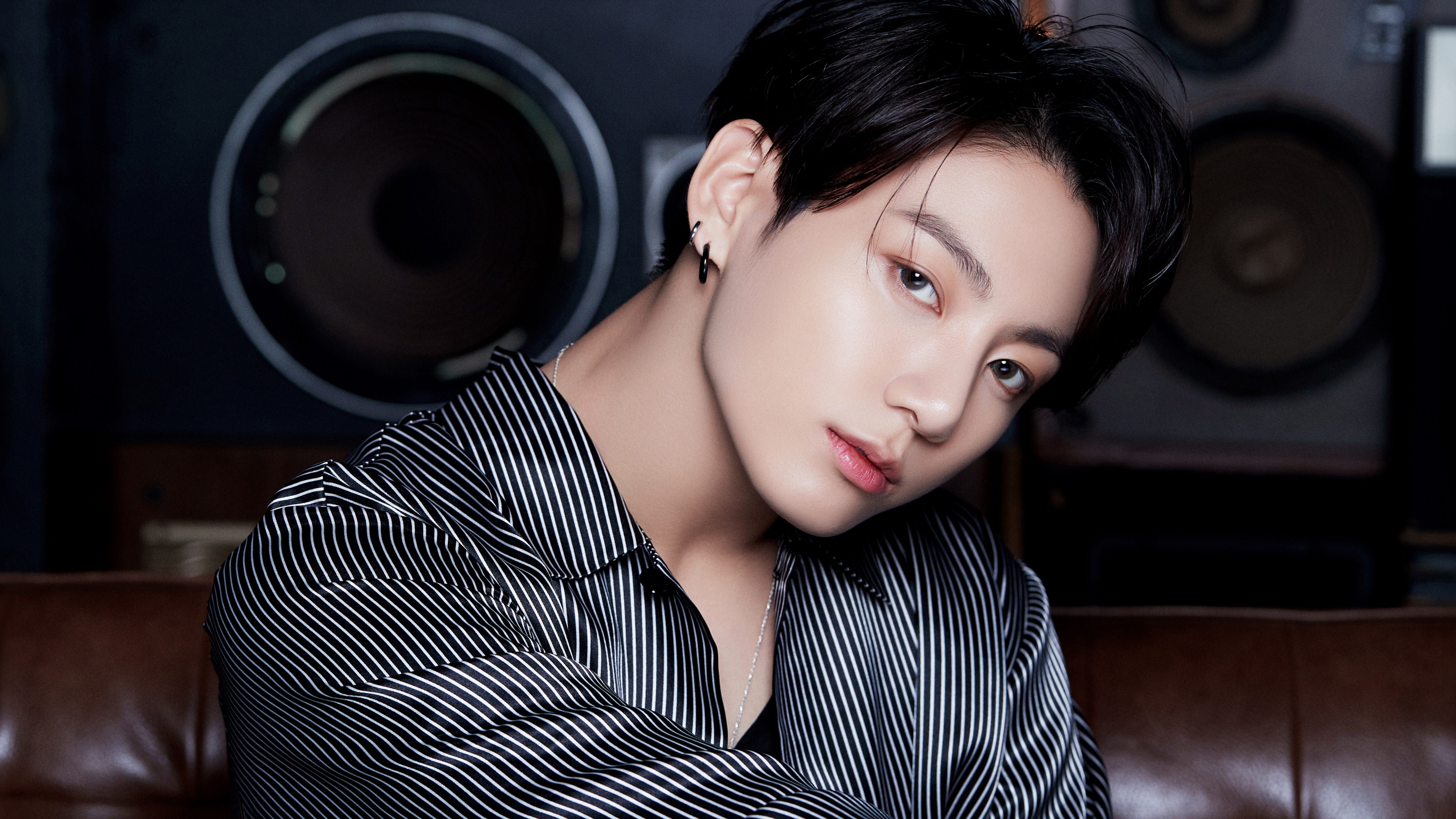 A detailed close-up portrait of Jungkook, a member of the K-pop group BTS