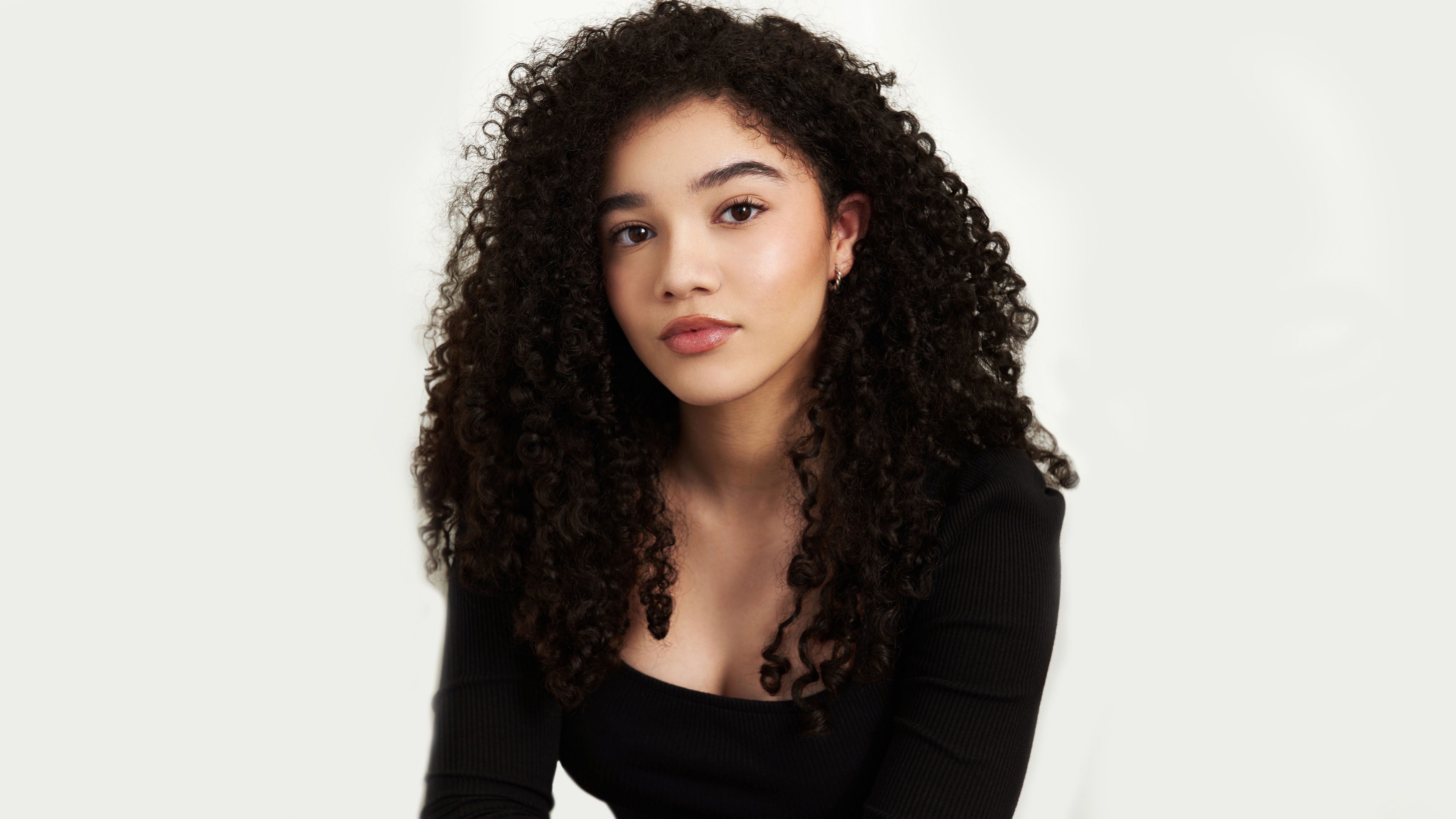 Professional high-resolution portrait of Canadian actress Malia Baker on a white background.