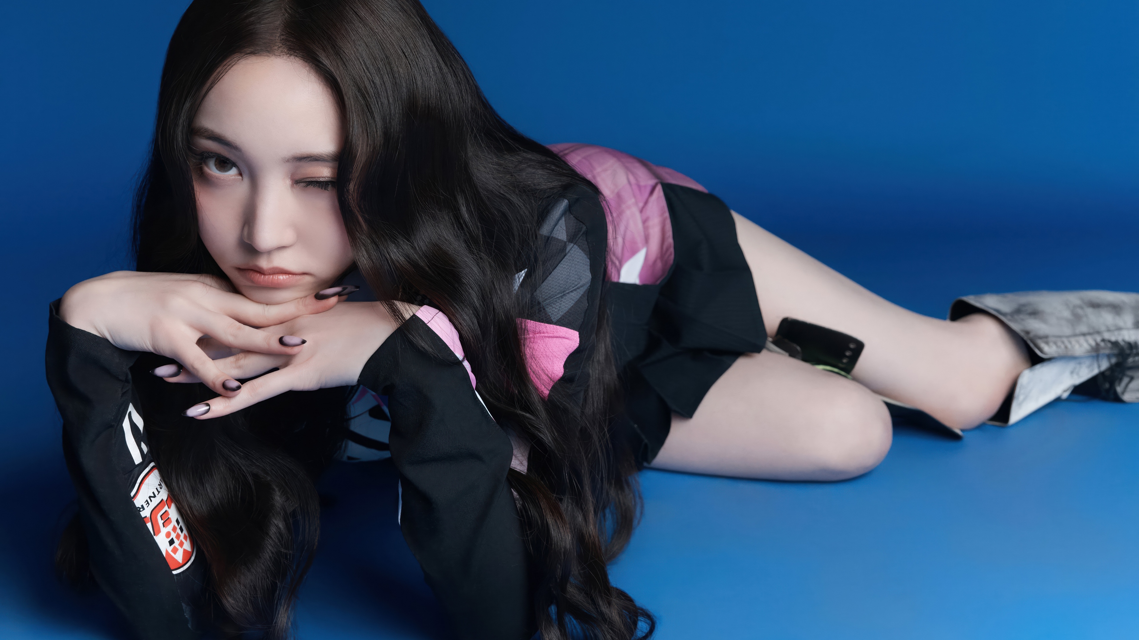 A high-quality professional portrait of South Korean singer Youngseo from ALLDAY PROJECT against a vibrant blue background.