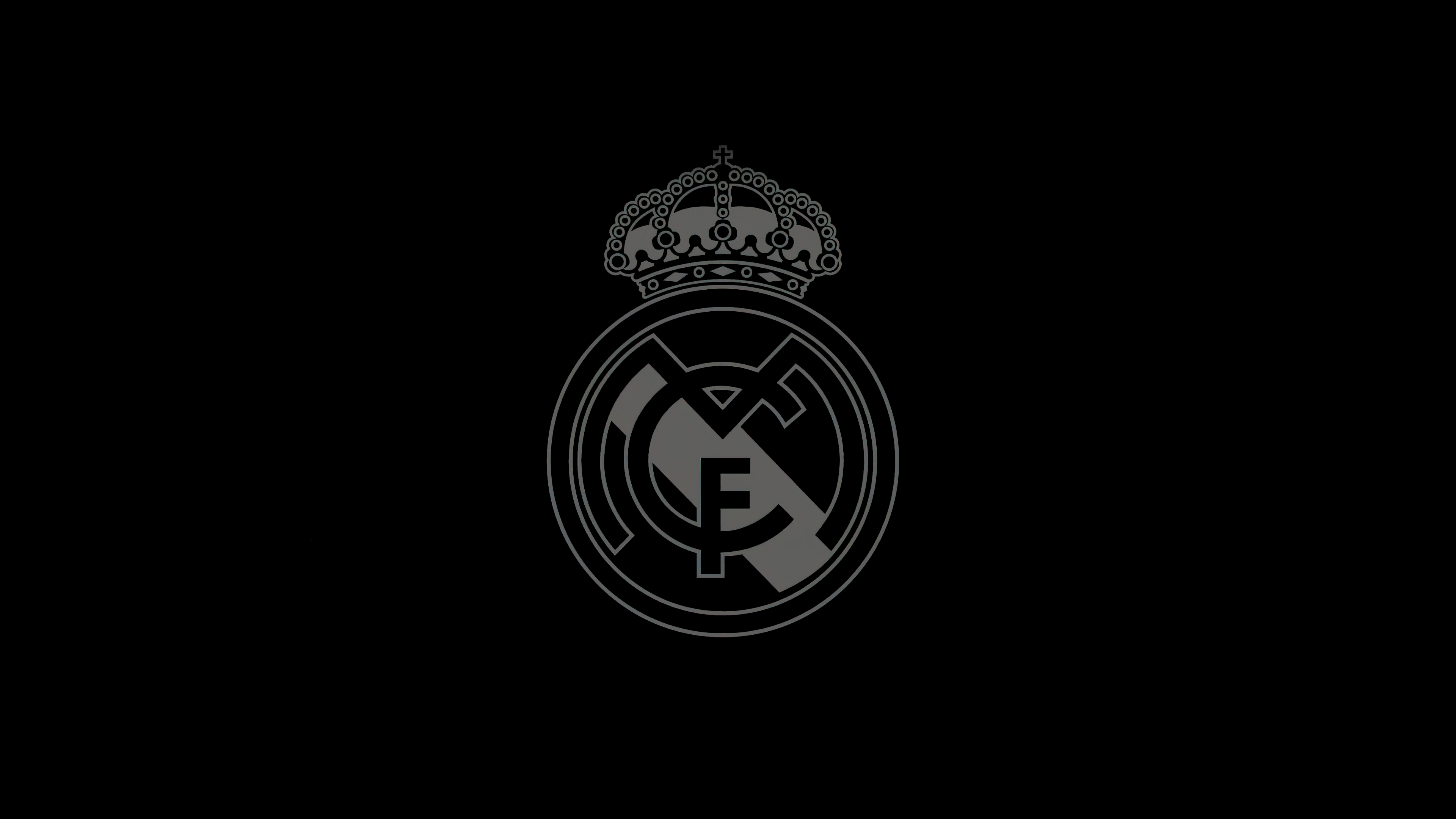 Minimalist Real Madrid CF football club logo on a black background