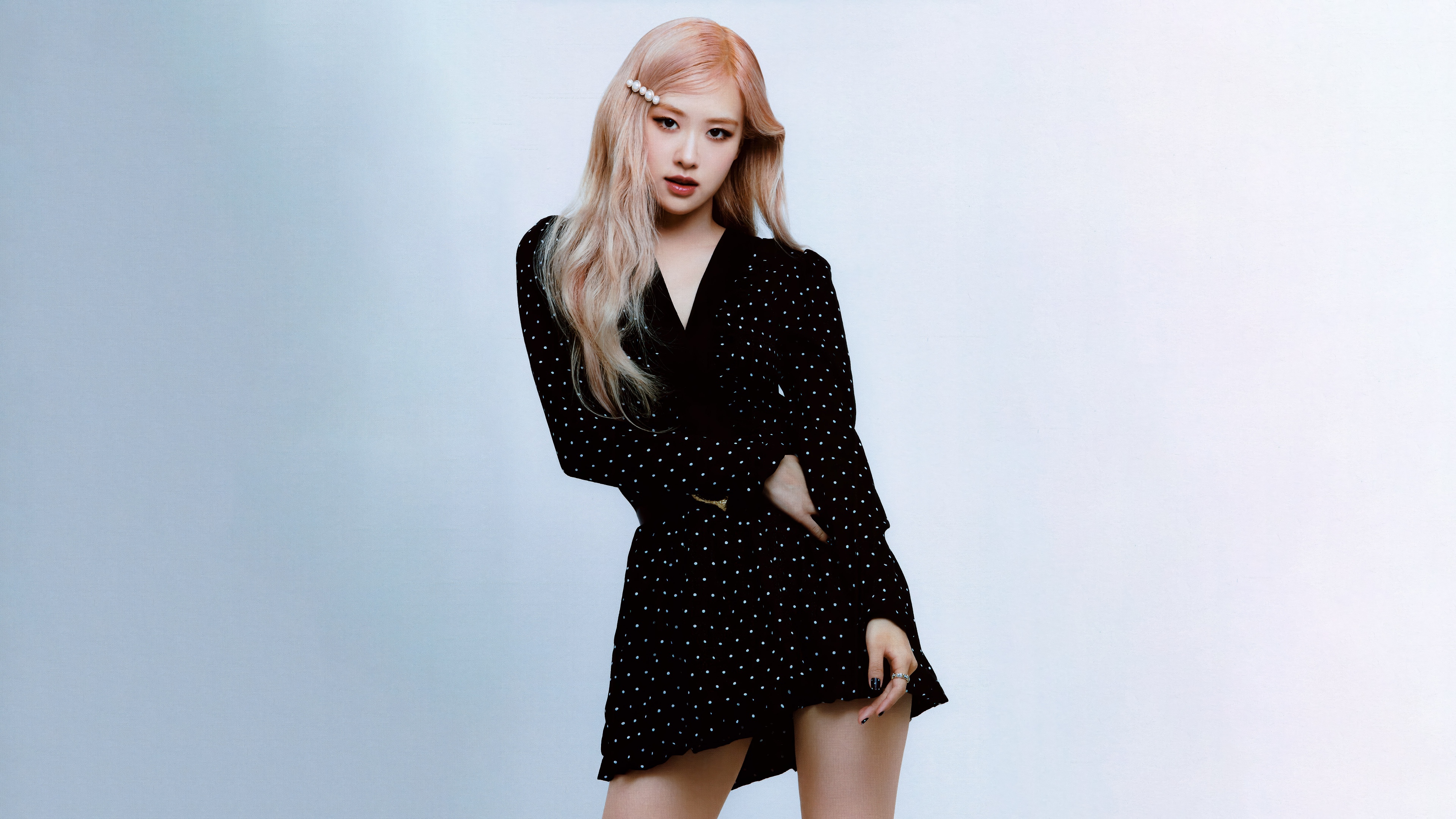 A high-resolution, elegant portrait of Rosé from BLACKPINK wearing a stylish black dress.