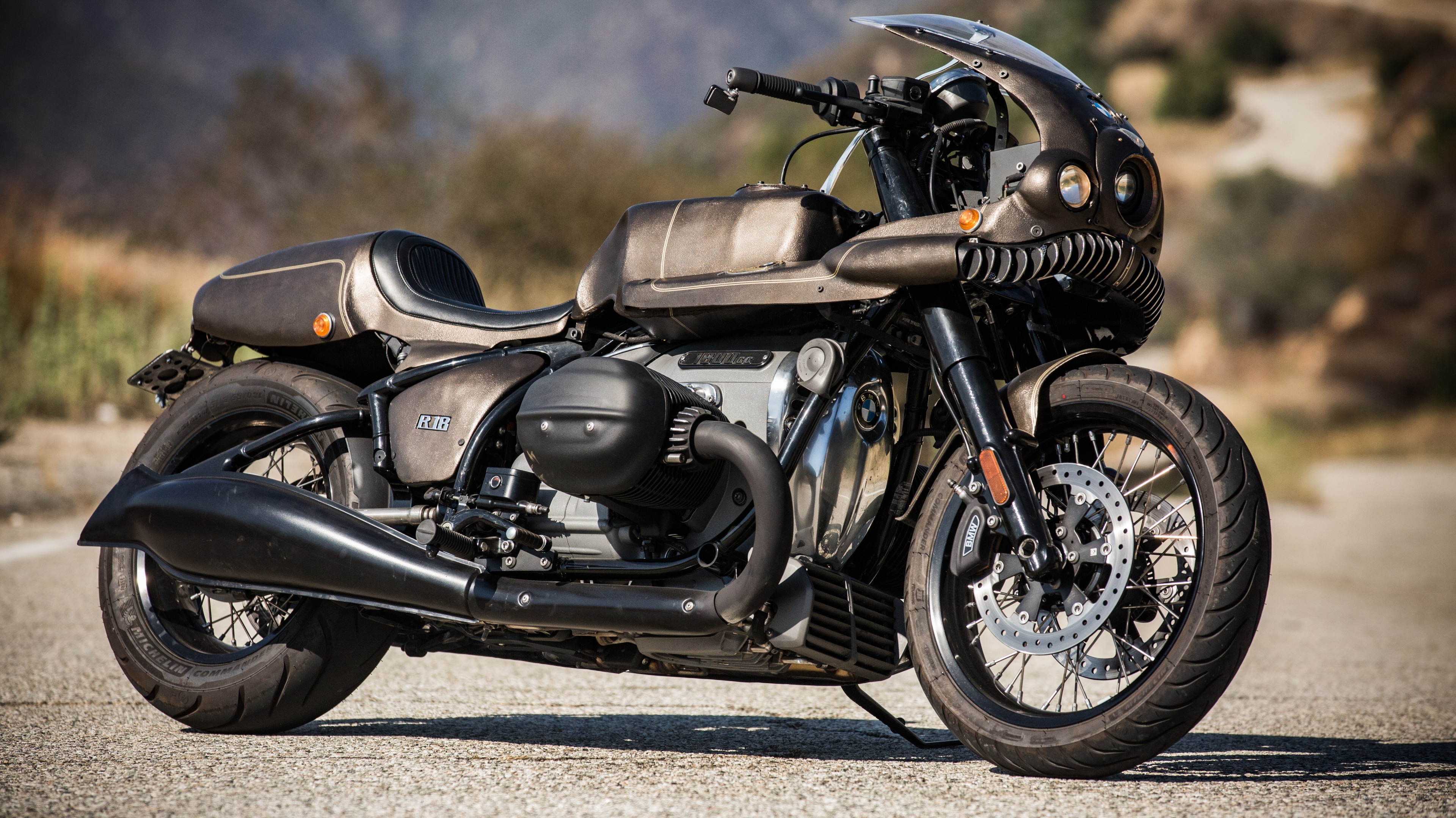 A close-up shot of a premium custom motorcycle with metallic finishes and polished chrome parts.