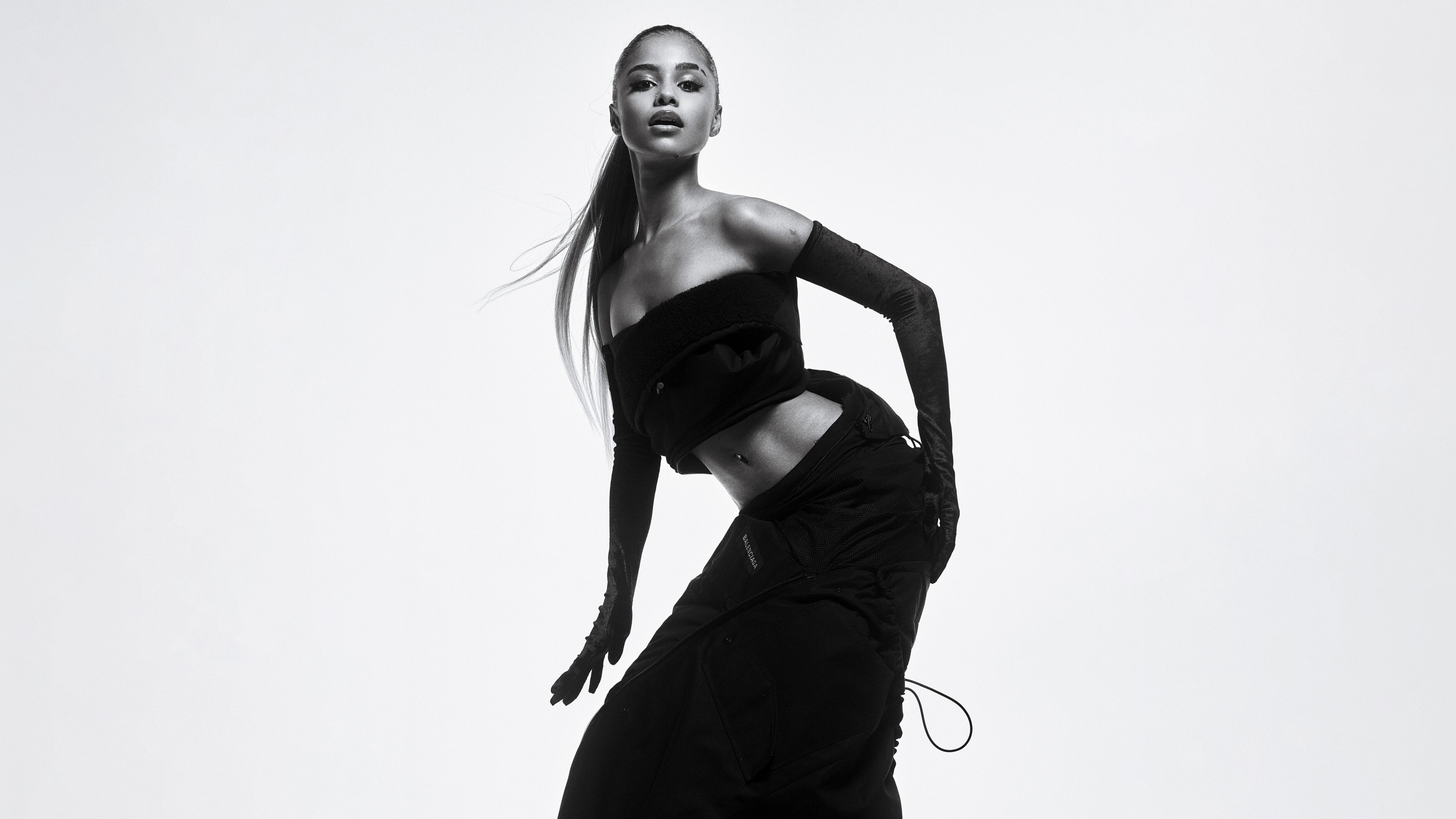 A high-resolution black and white portrait of South African singer Tyla against a white background.
