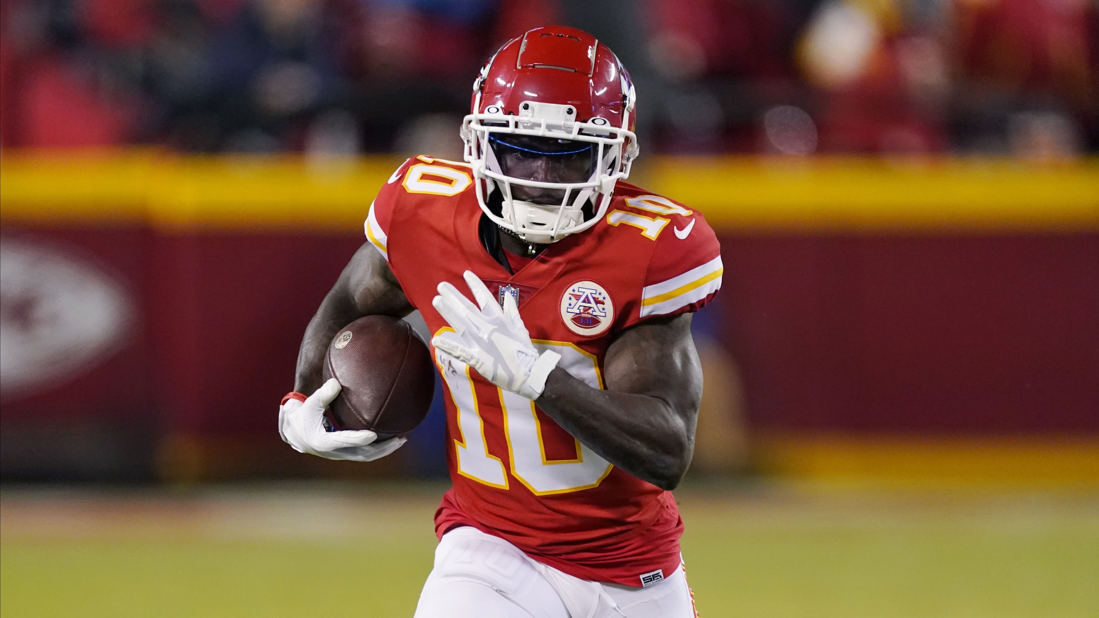 Professional American football wide receiver Tyreek Hill in a Kansas City Chiefs uniform.
