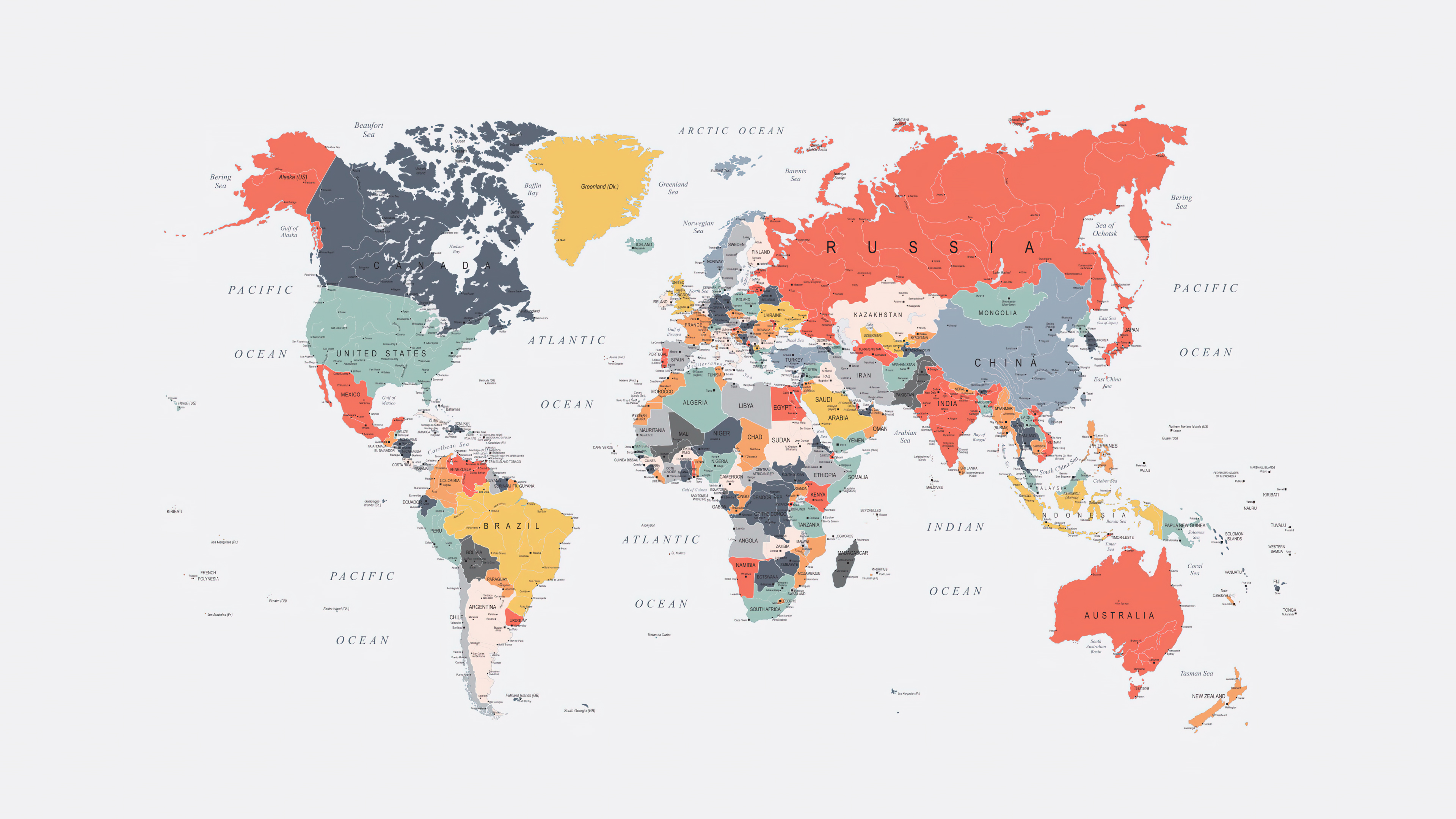 A colorful and vibrant world map with brightly colored continents and oceans in a spectrum of hues.