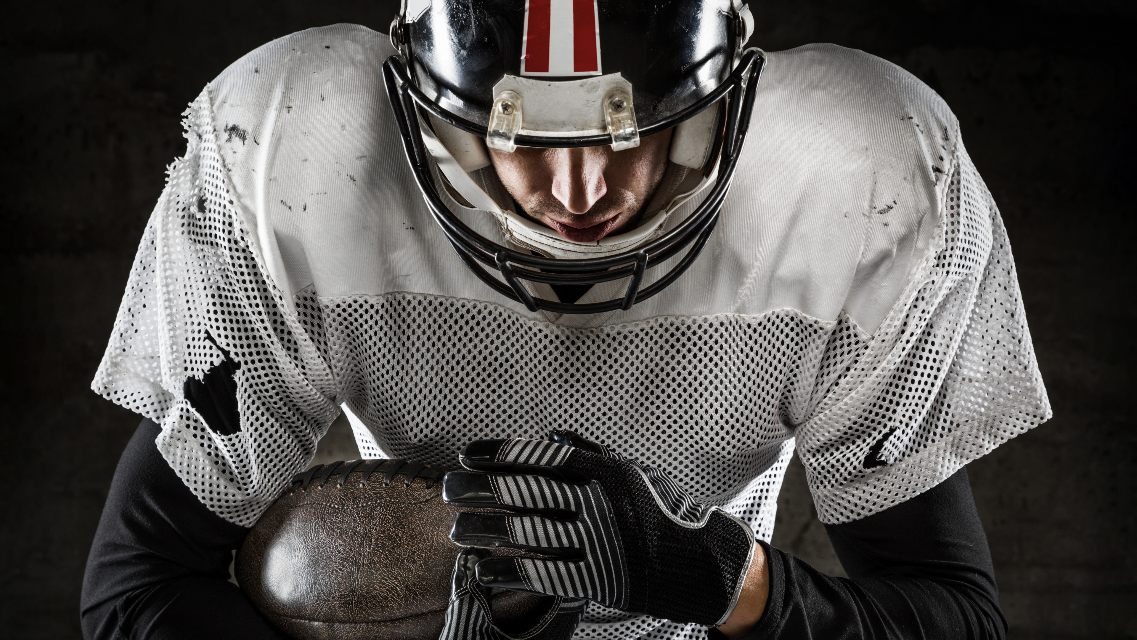 A professional American football player featured in a cinematic shot against a dark, atmospheric background.