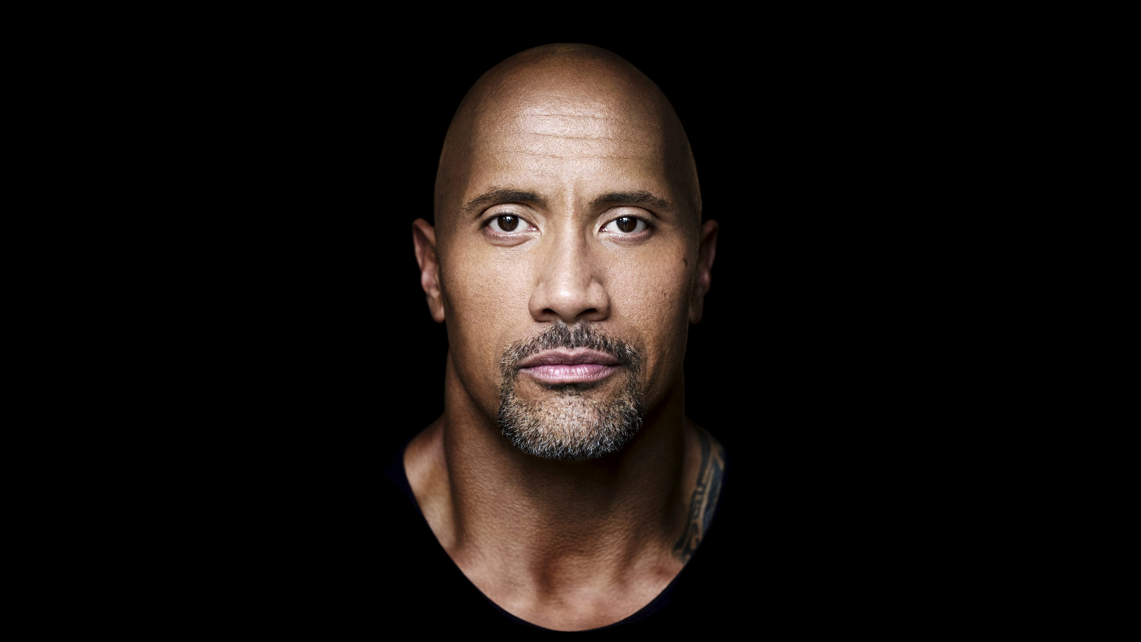 A high-contrast 5K portrait of American actor Dwayne Johnson against a solid black background.