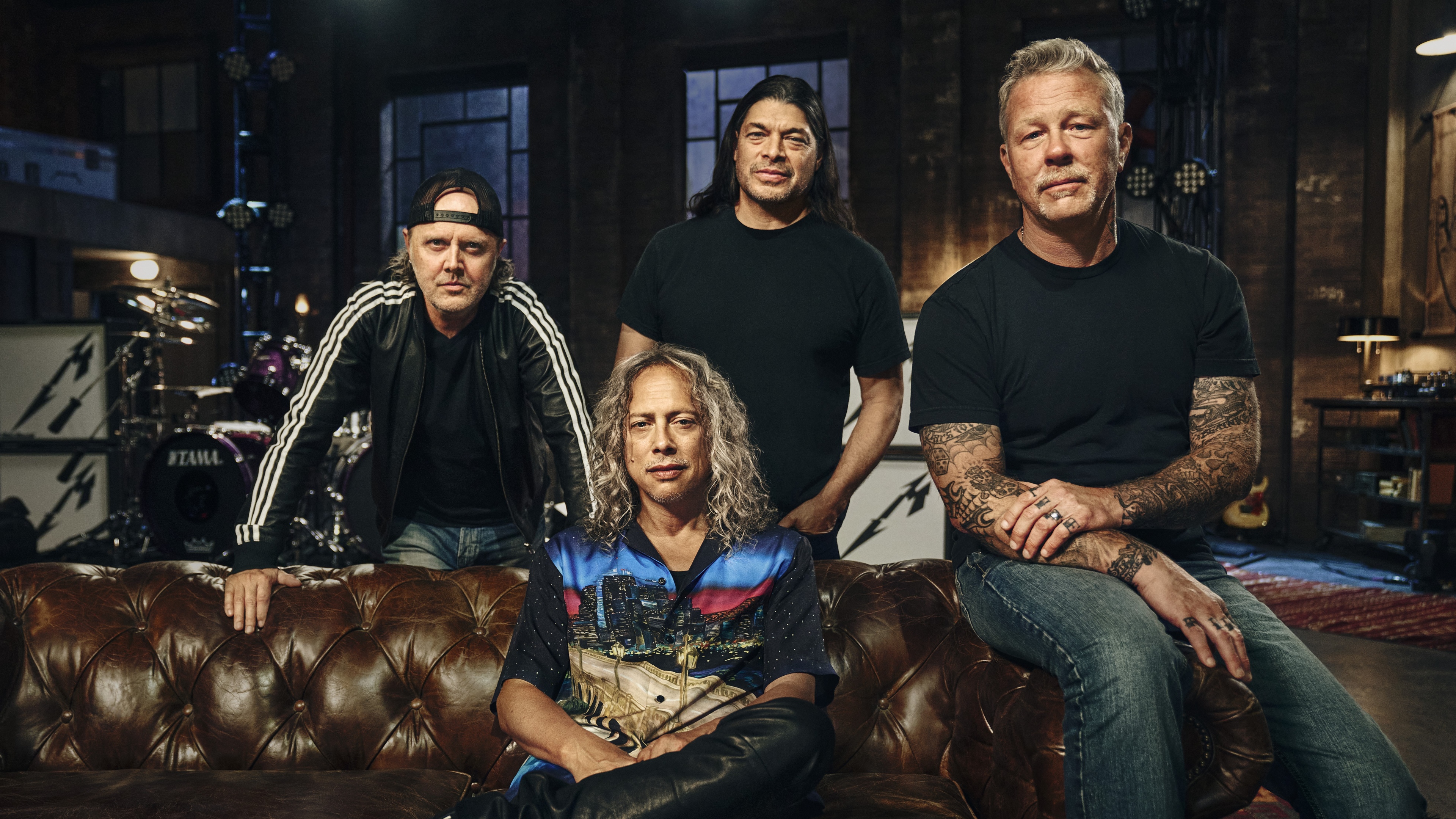 A detailed portrait of Metallica members James Hetfield, Lars Ulrich, Kirk Hammett, and Robert Trujillo.